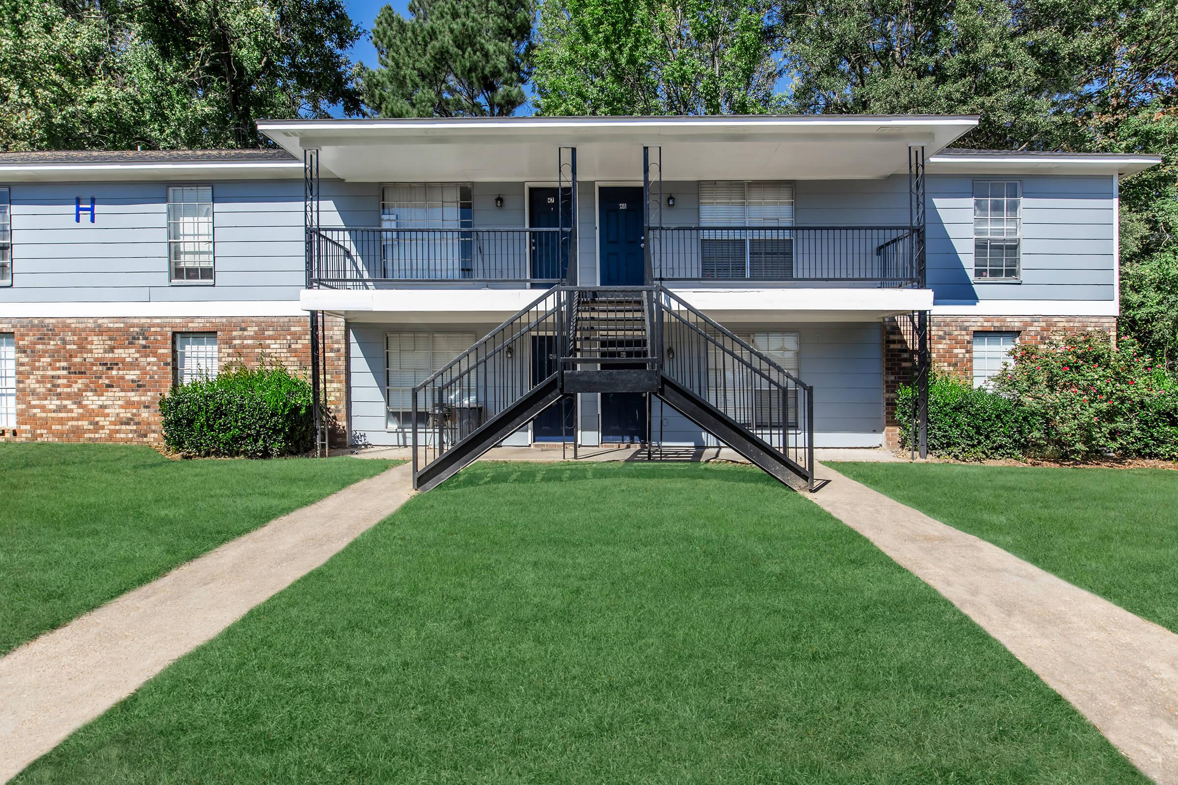 a large lawn in front of a house