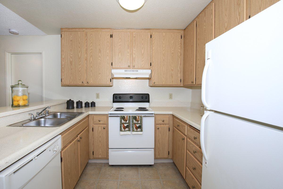 a kitchen with a stove top oven sitting inside of a refrigerator