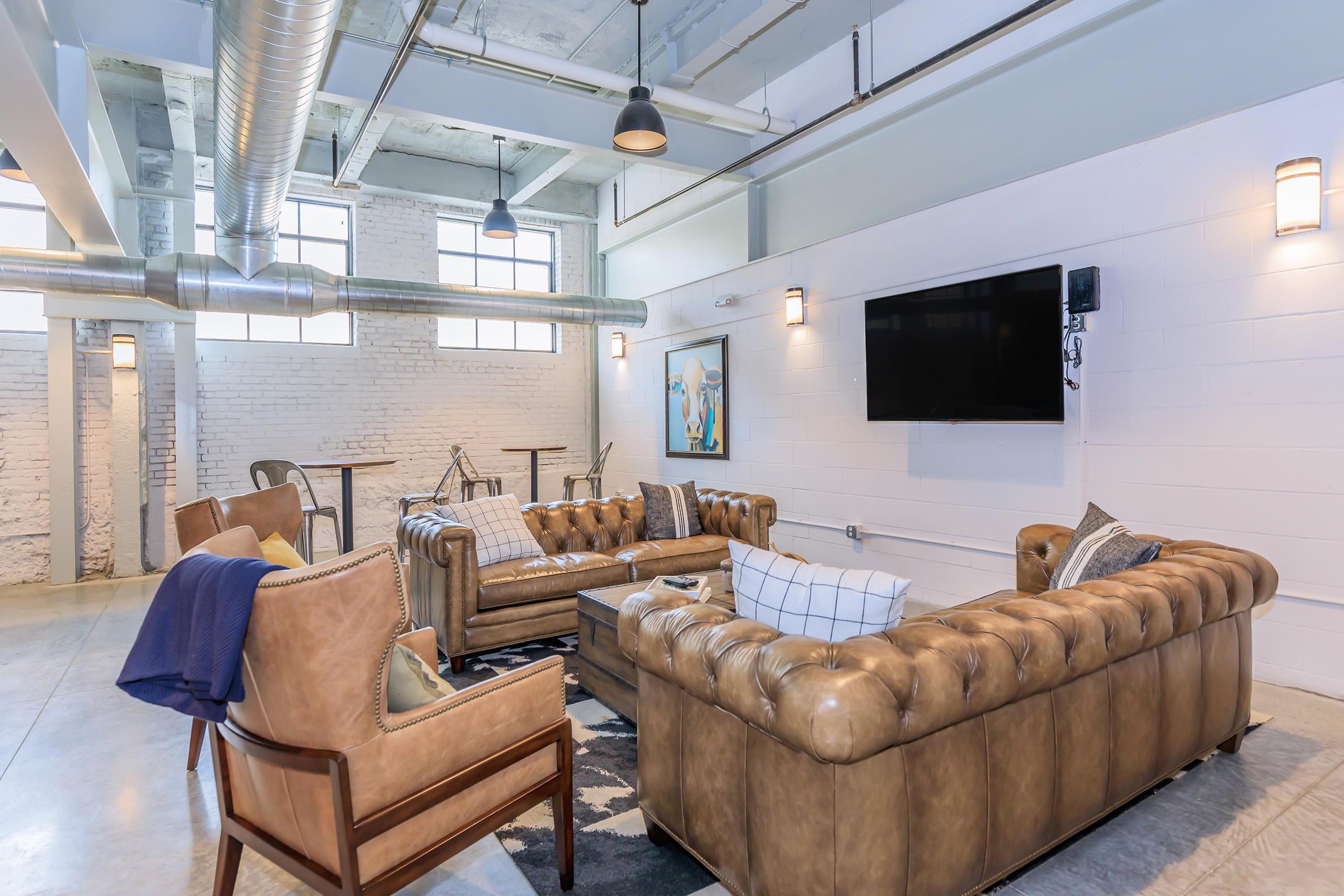 a living room filled with lots of furniture