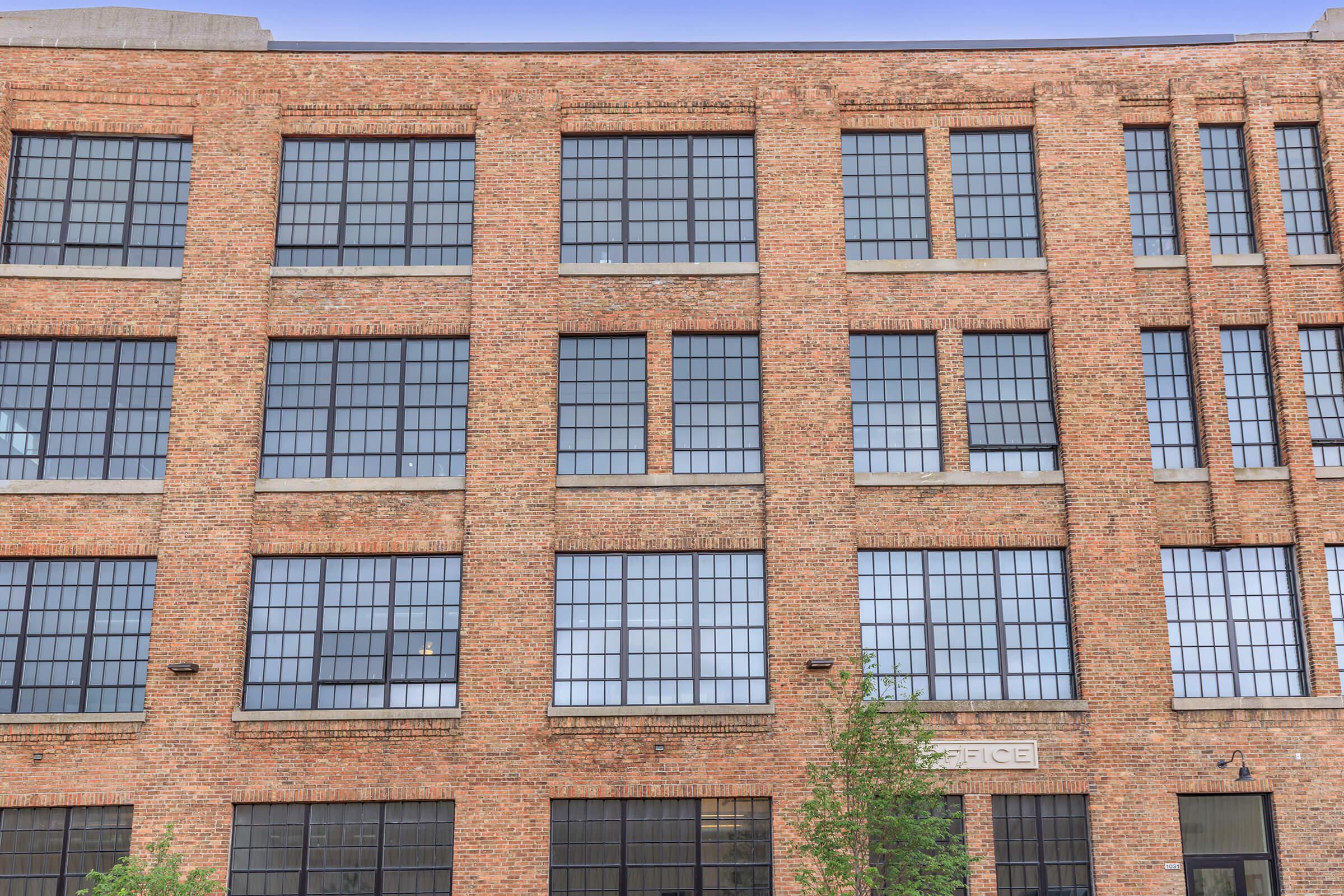 a tall brown brick building