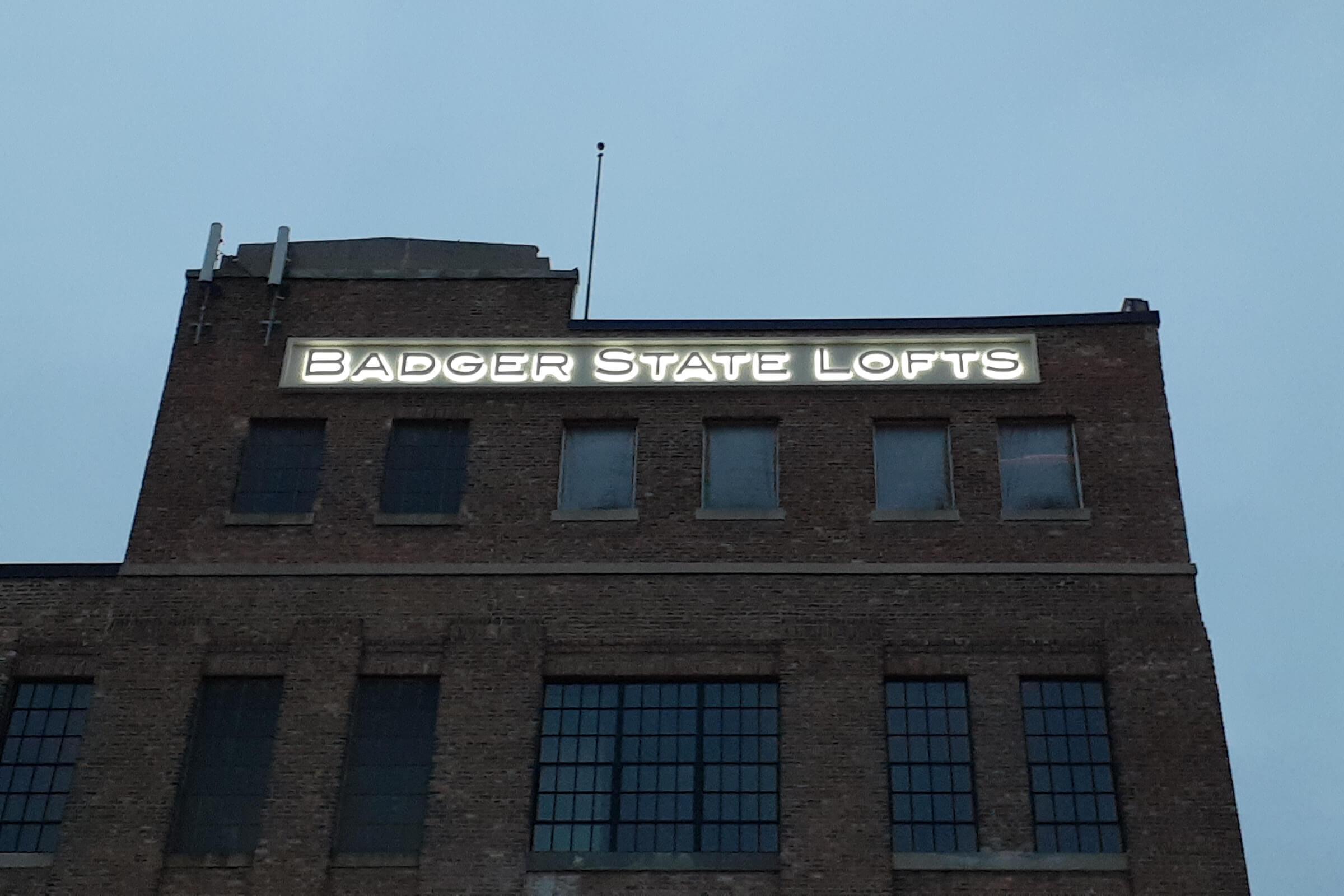a large brick tower with a clock on the side of a building