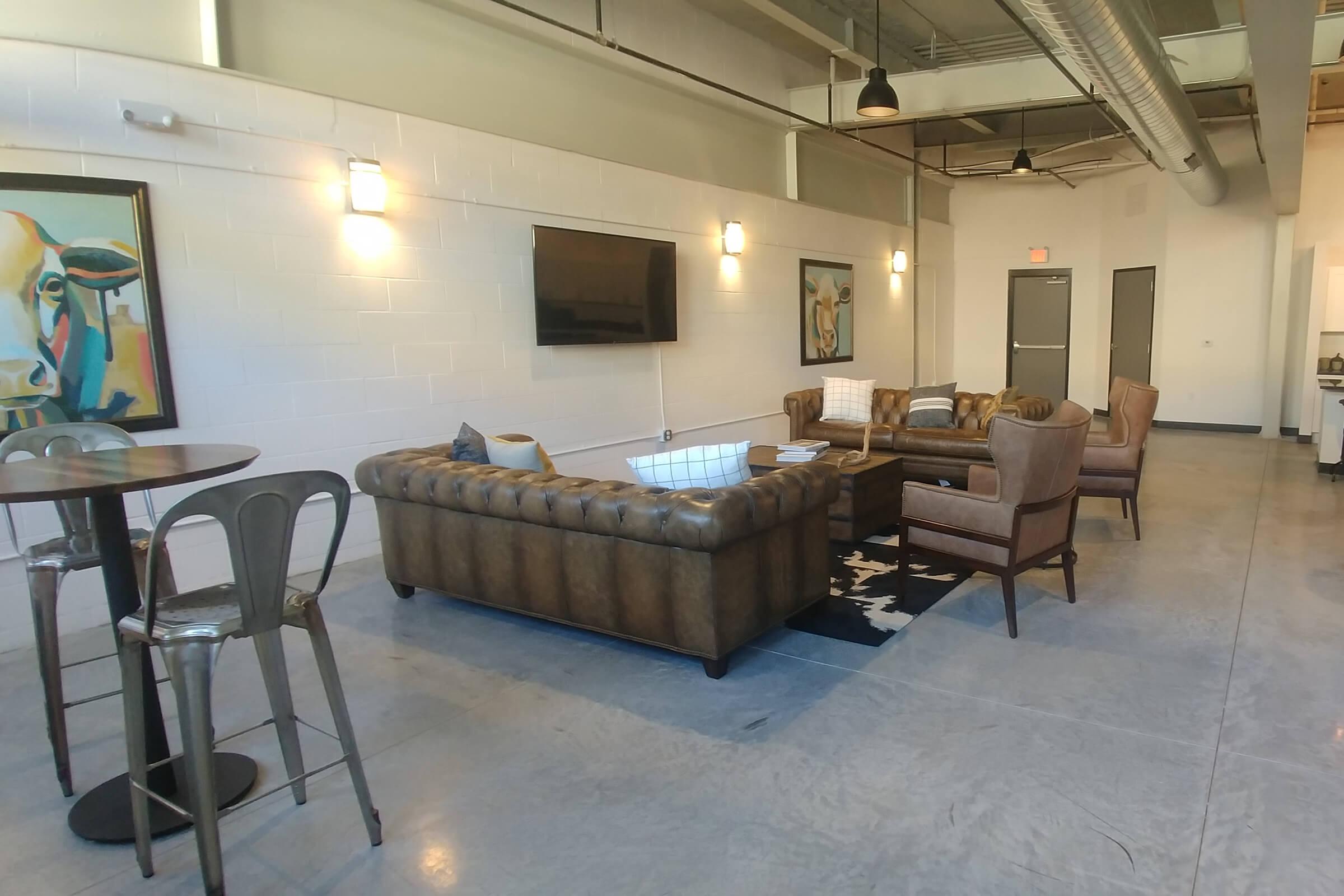 a room filled with furniture and a table