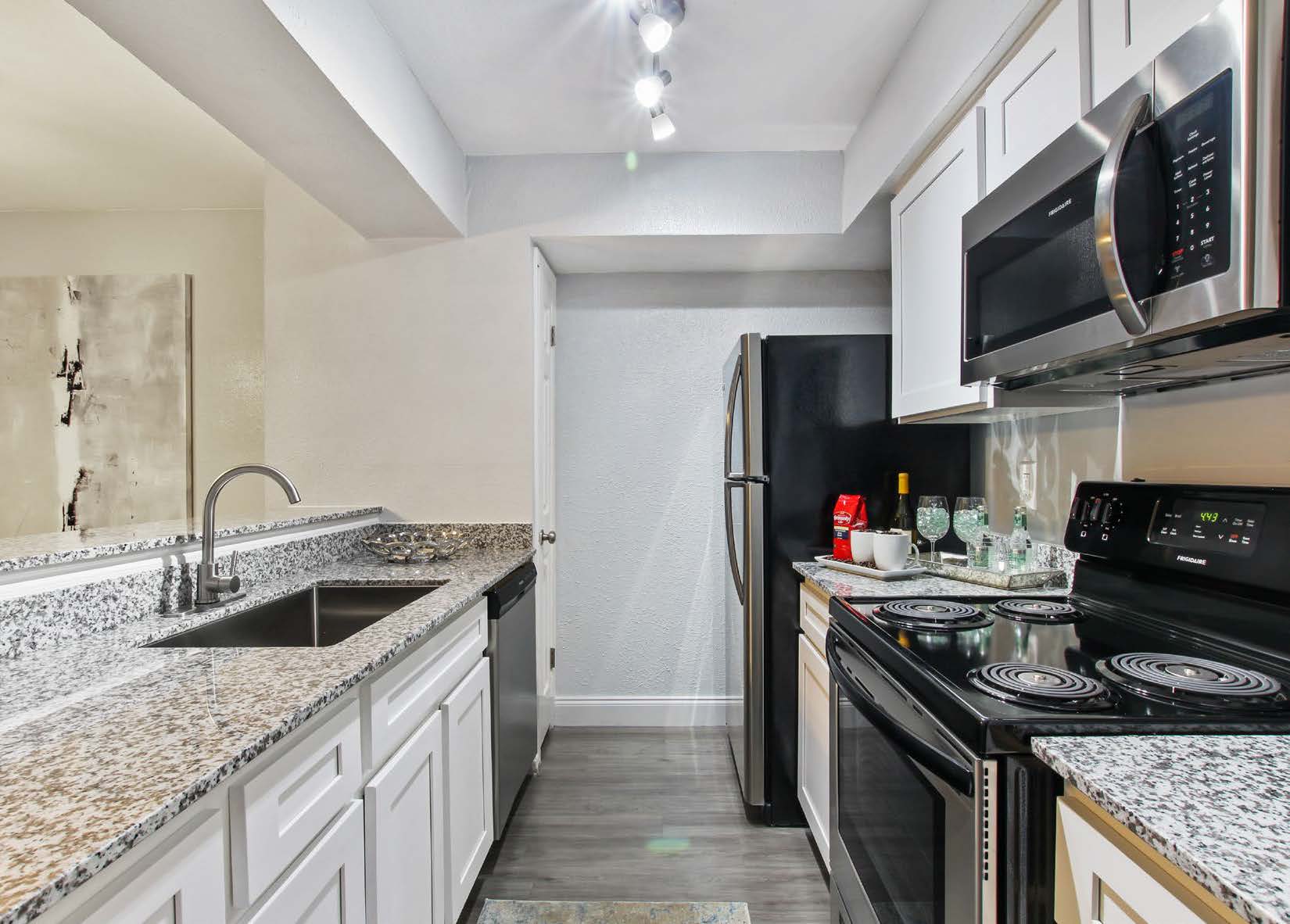 a large kitchen with stainless steel appliances