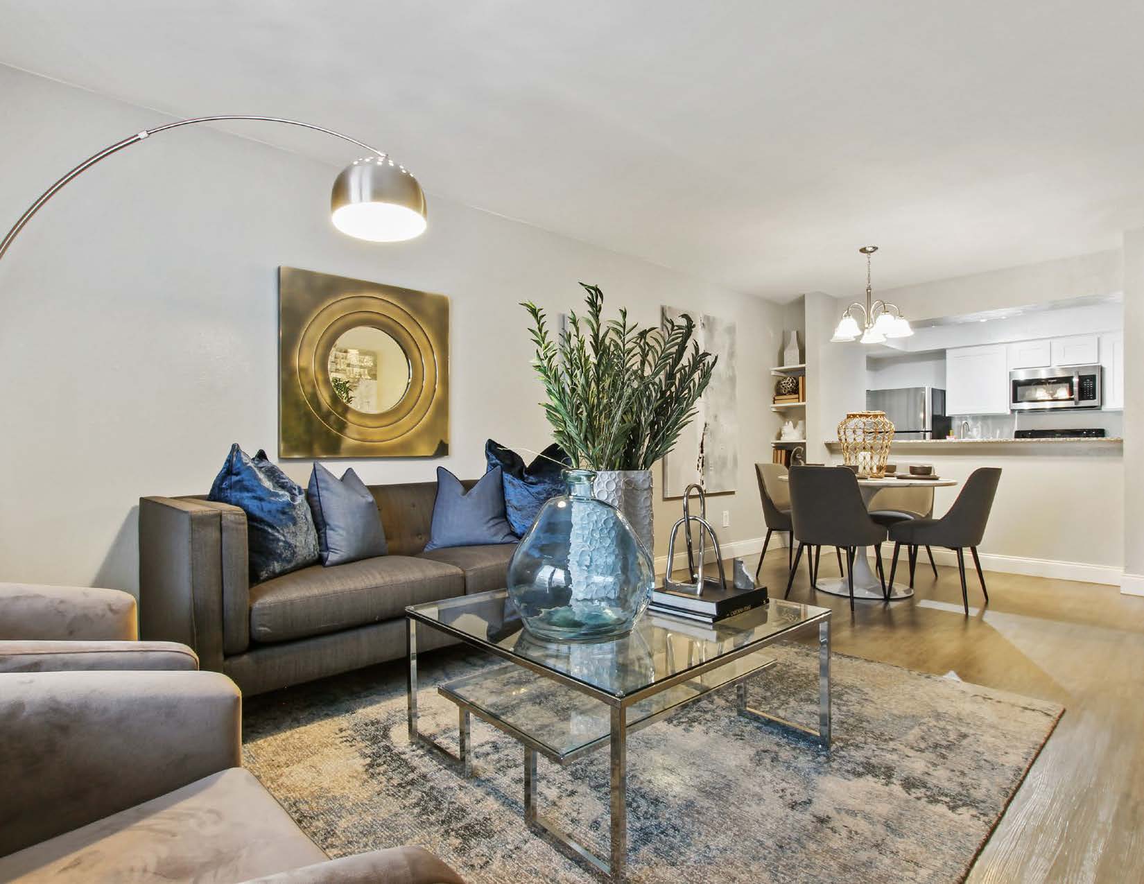 a living room filled with furniture and a fire place