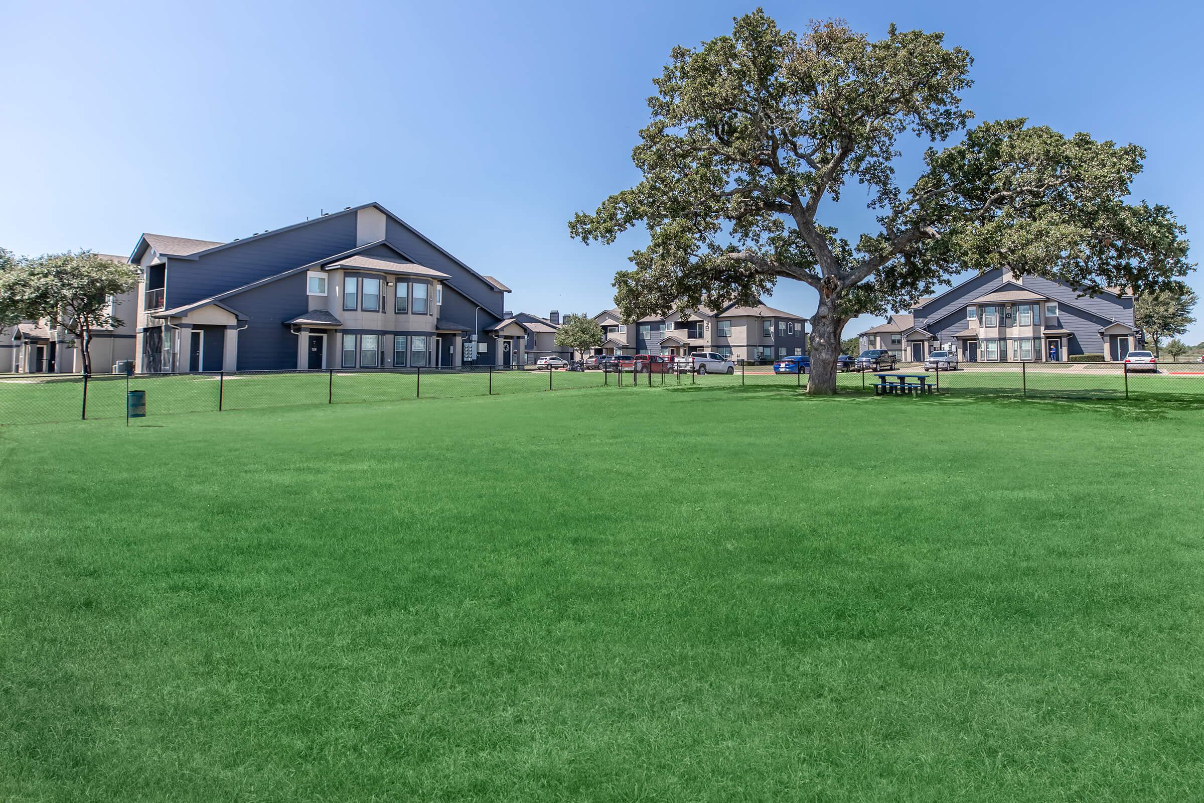 a large lawn in front of a house