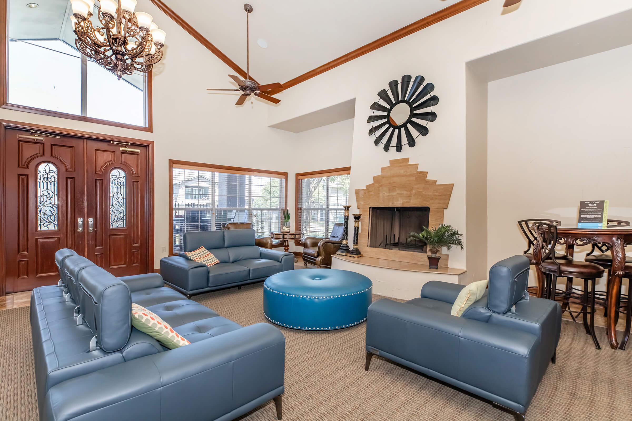 a living room filled with furniture and a large window