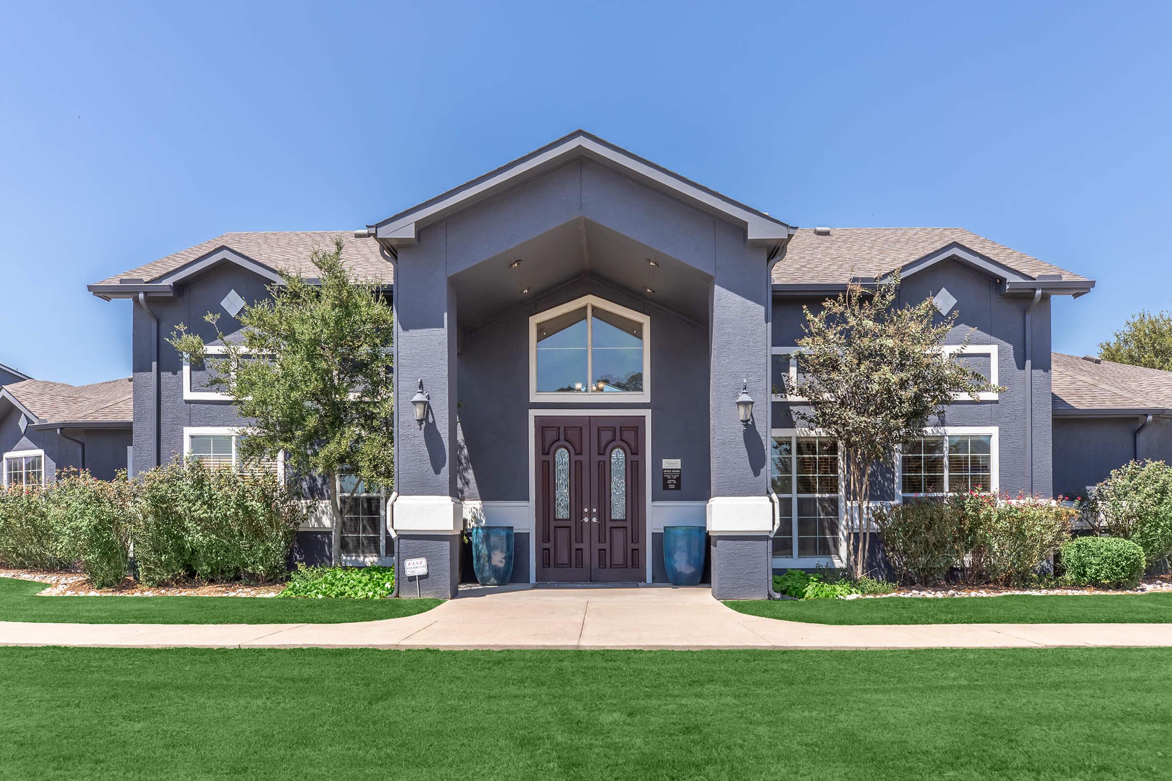 a large lawn in front of a house