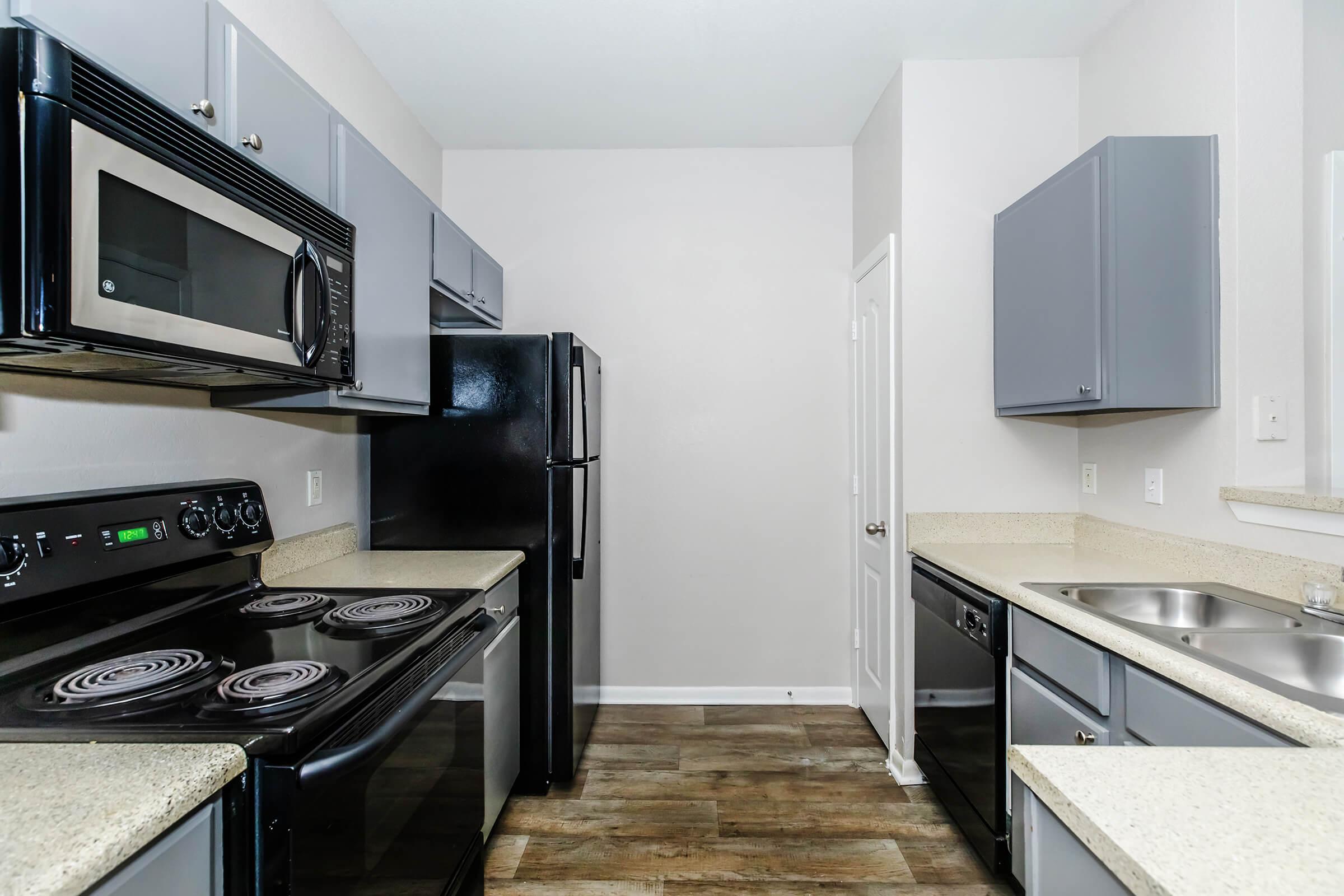 a modern kitchen with stainless steel appliances