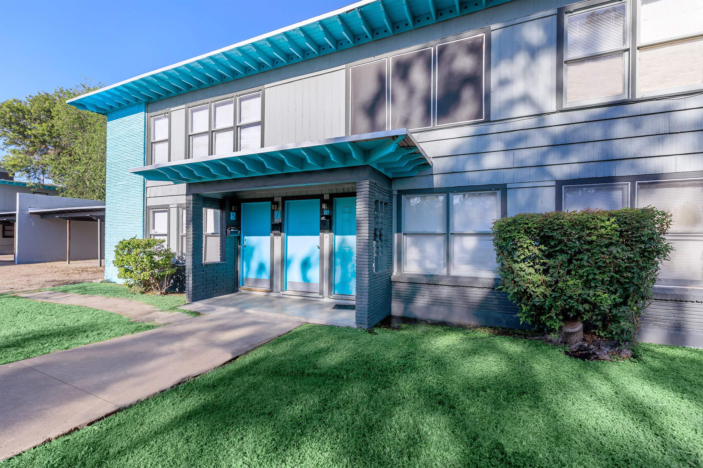 a building with green grass