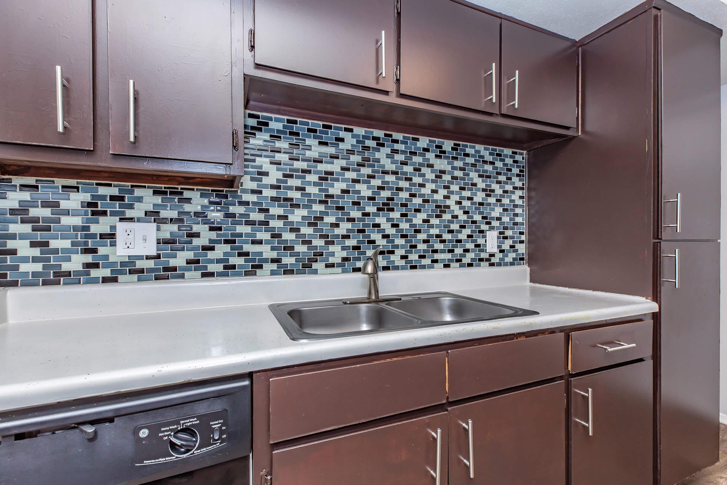 Beautiful tile backsplash in the kitchen at The Park at Summerhill Road