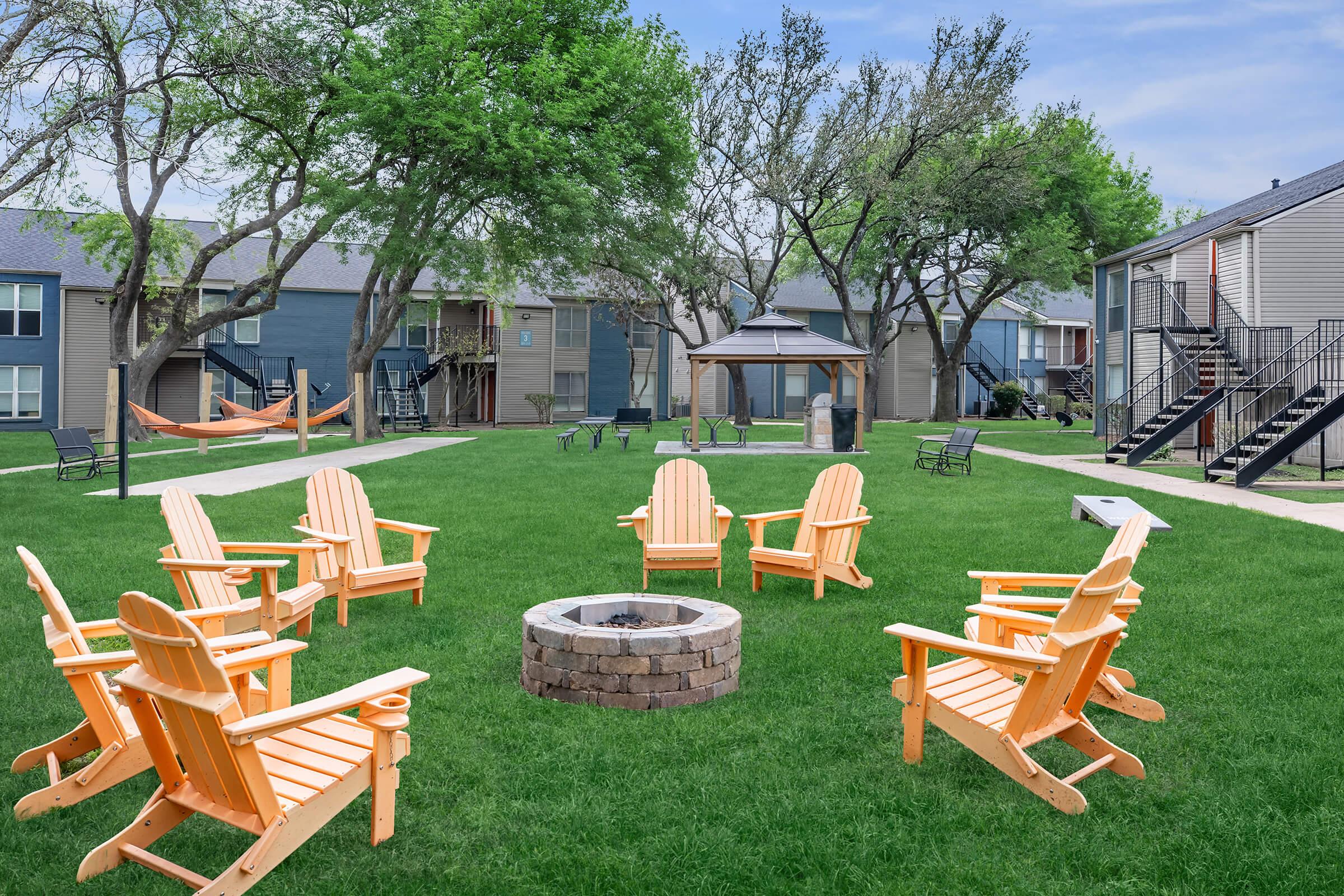 a group of lawn chairs sitting on top of a picnic table