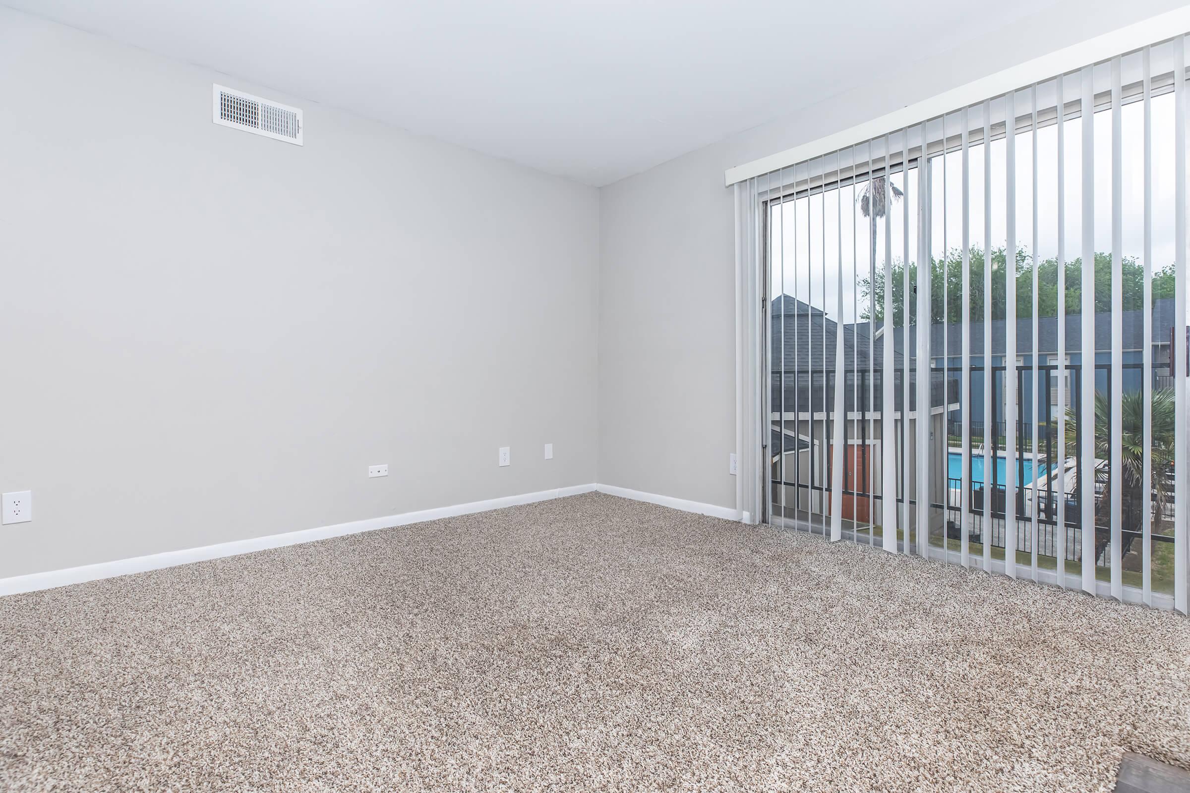 a bedroom with a large window