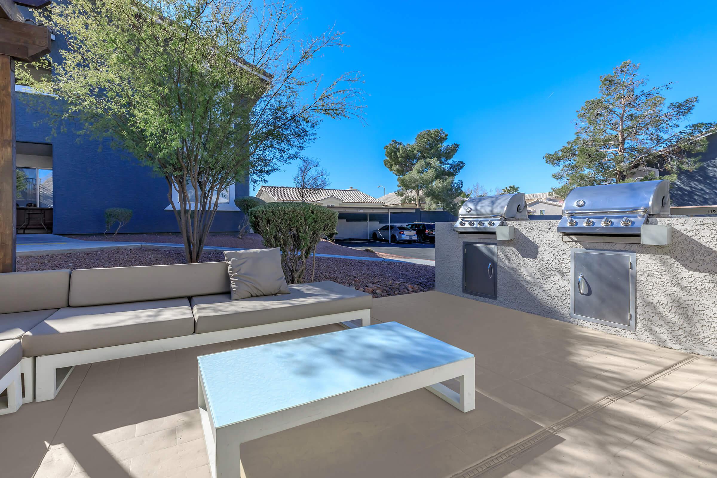 Barbecue and outdoor dining with TV at Sunset Hills in Henderson, Nevada