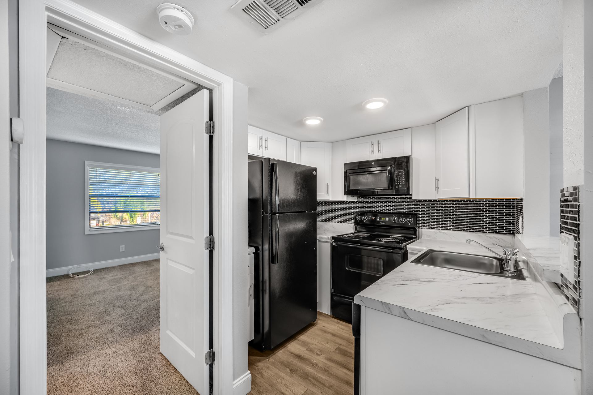 a large kitchen with stainless steel appliances