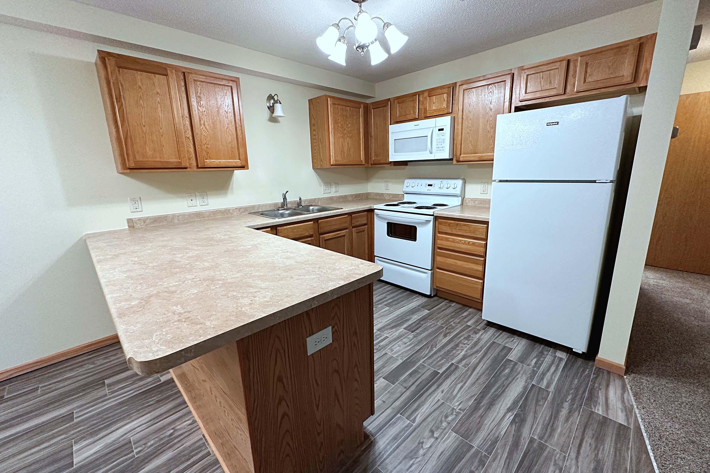 a kitchen with a stove top oven sitting inside of a building