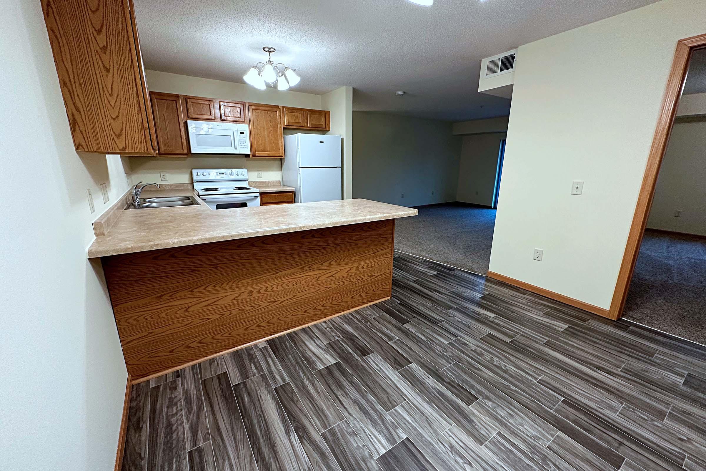 a bedroom with a wooden floor