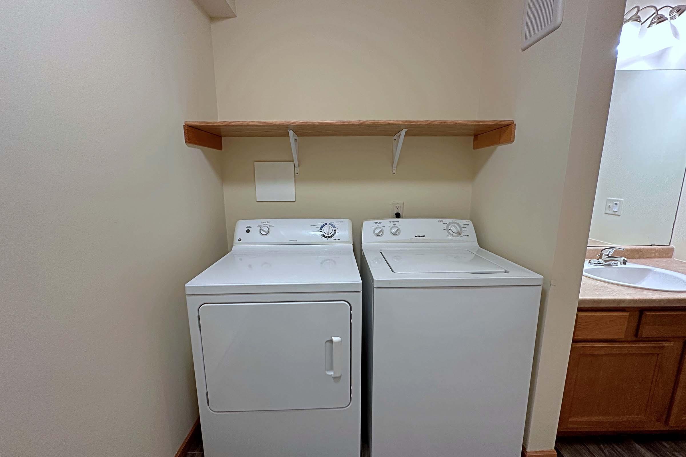 a kitchen with a sink and a refrigerator