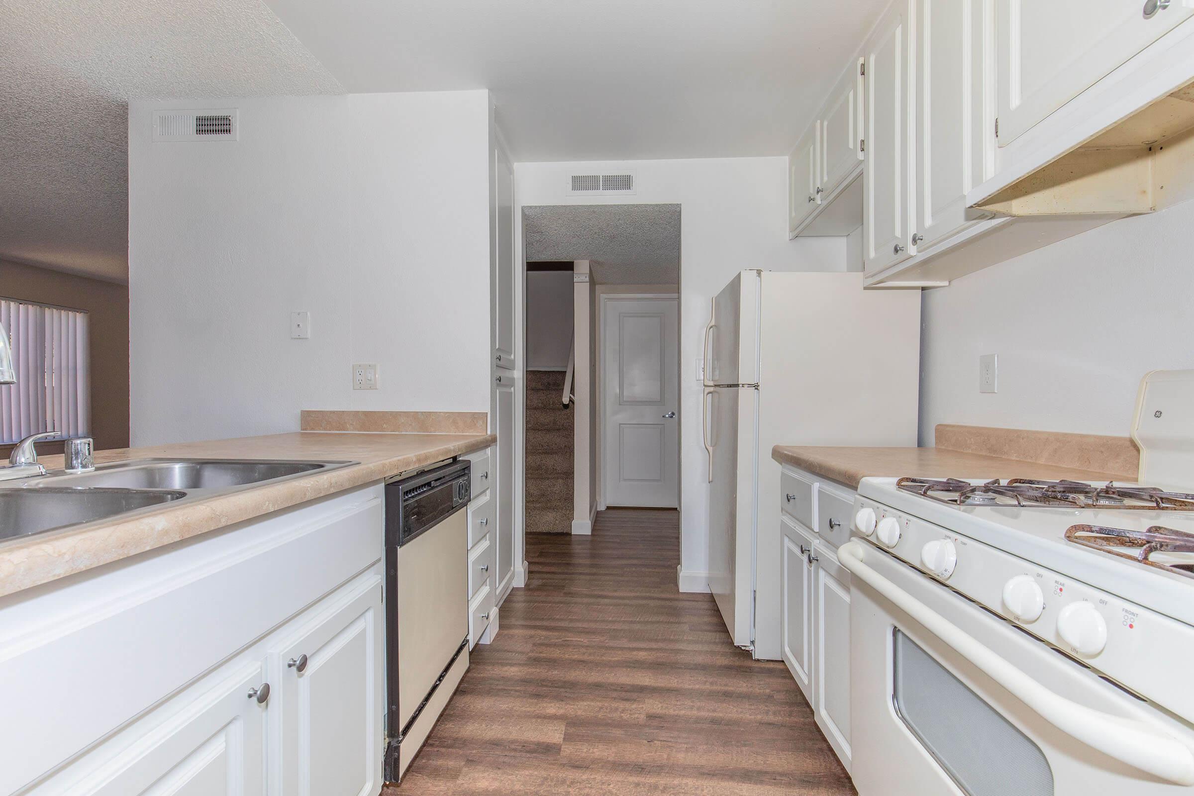 a kitchen with a sink and a microwave