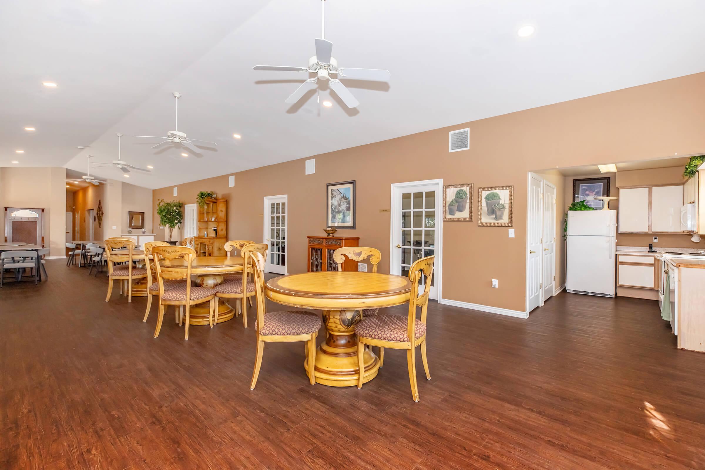 a room filled with furniture on top of a wooden floor