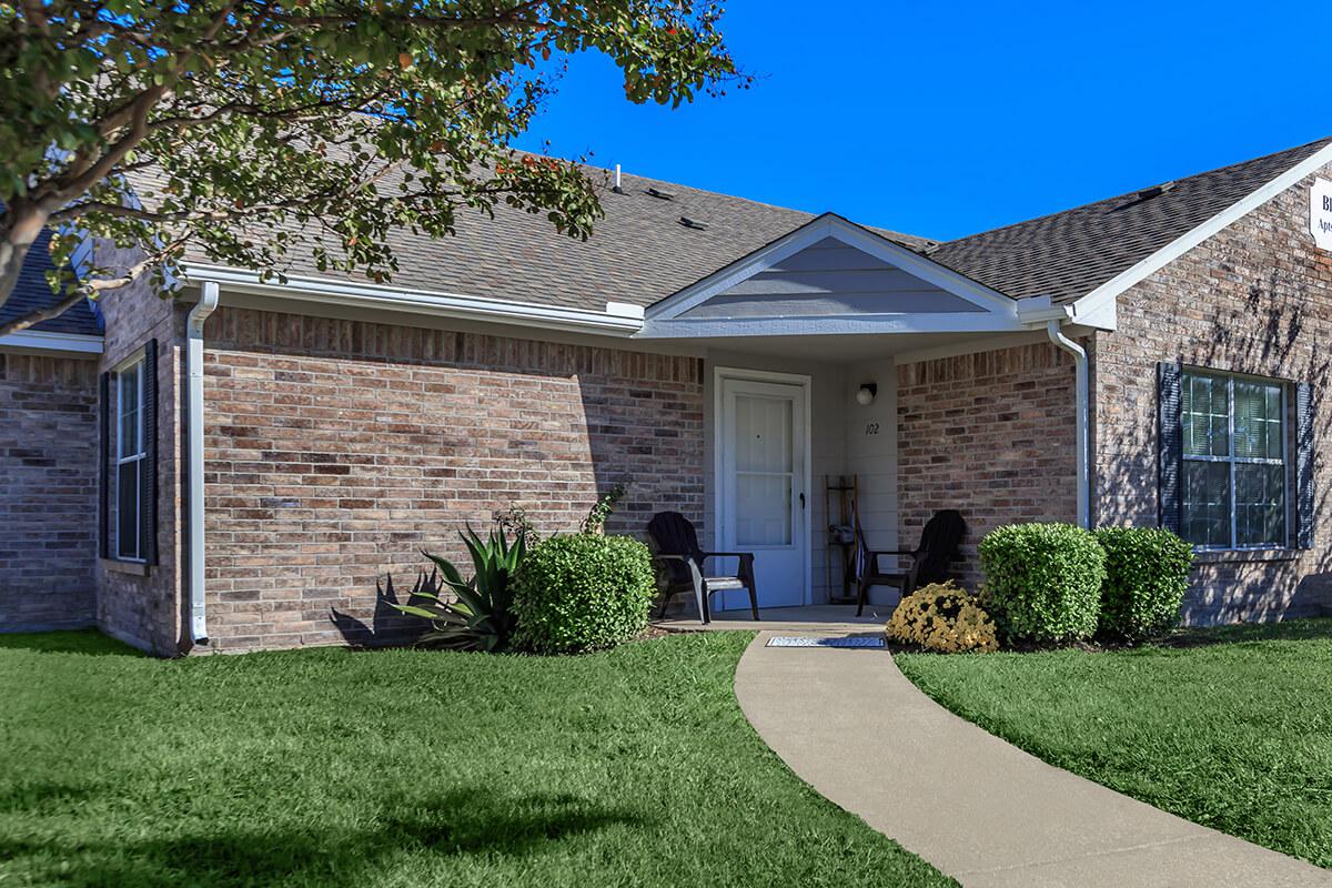 a large lawn in front of a house
