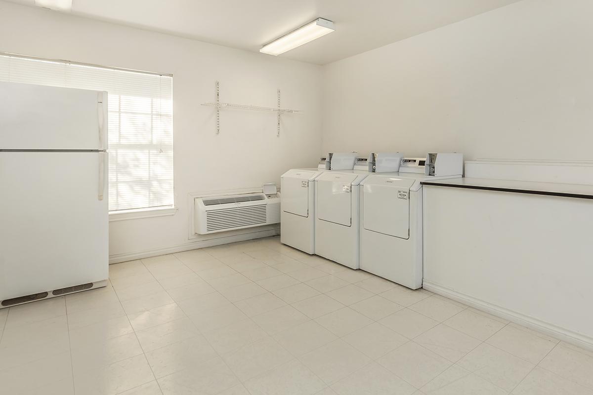 a large white refrigerator in a kitchen