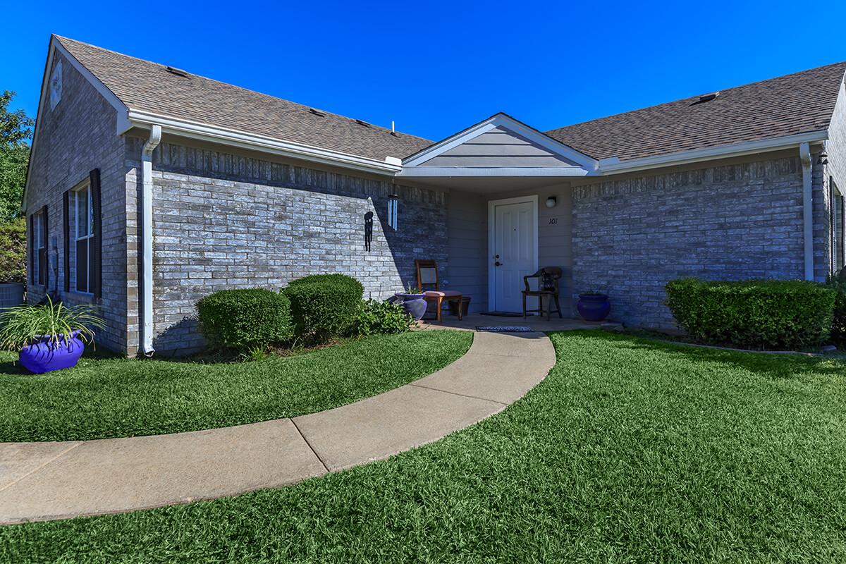 a large lawn in front of a house