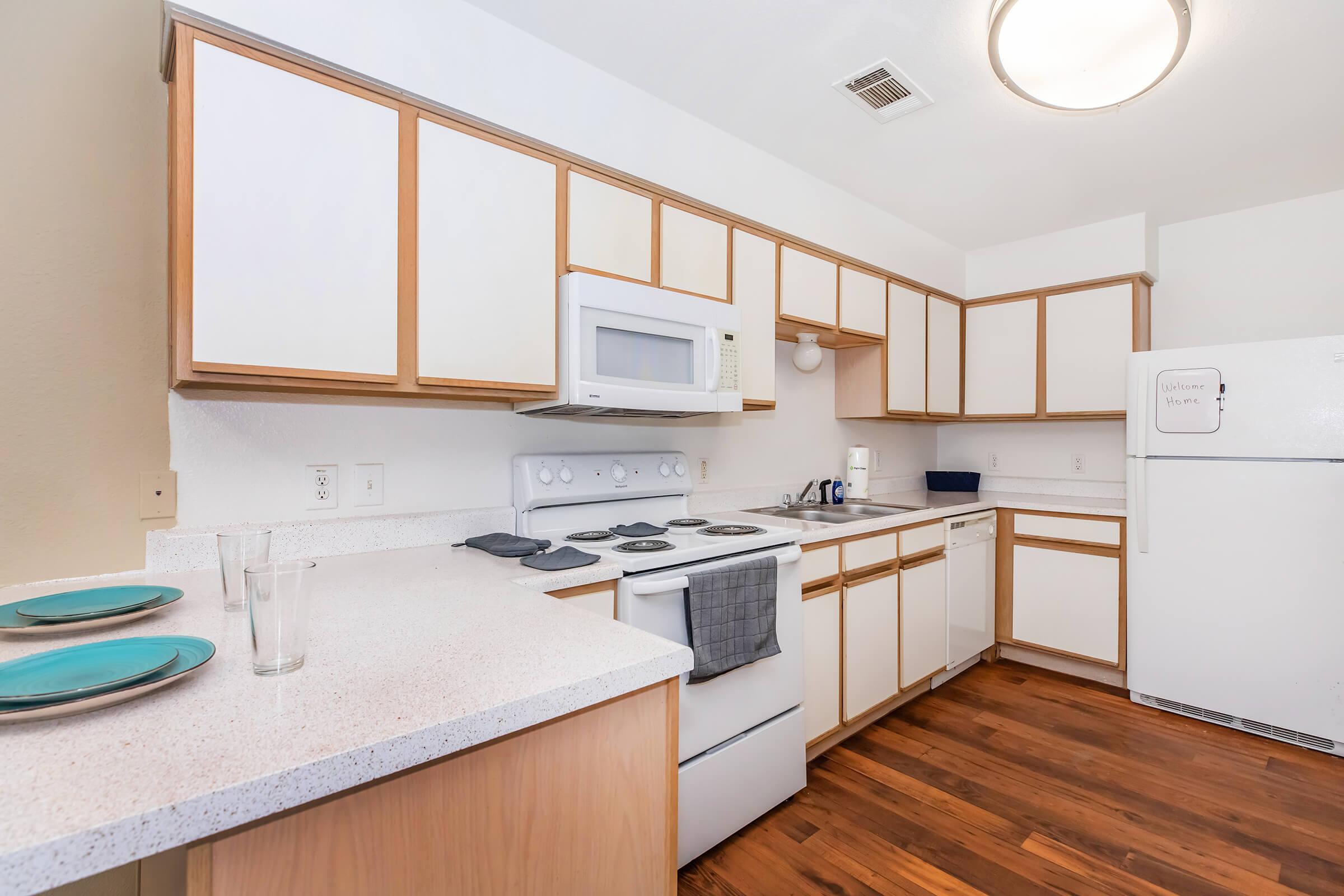 a kitchen with a stove and a sink