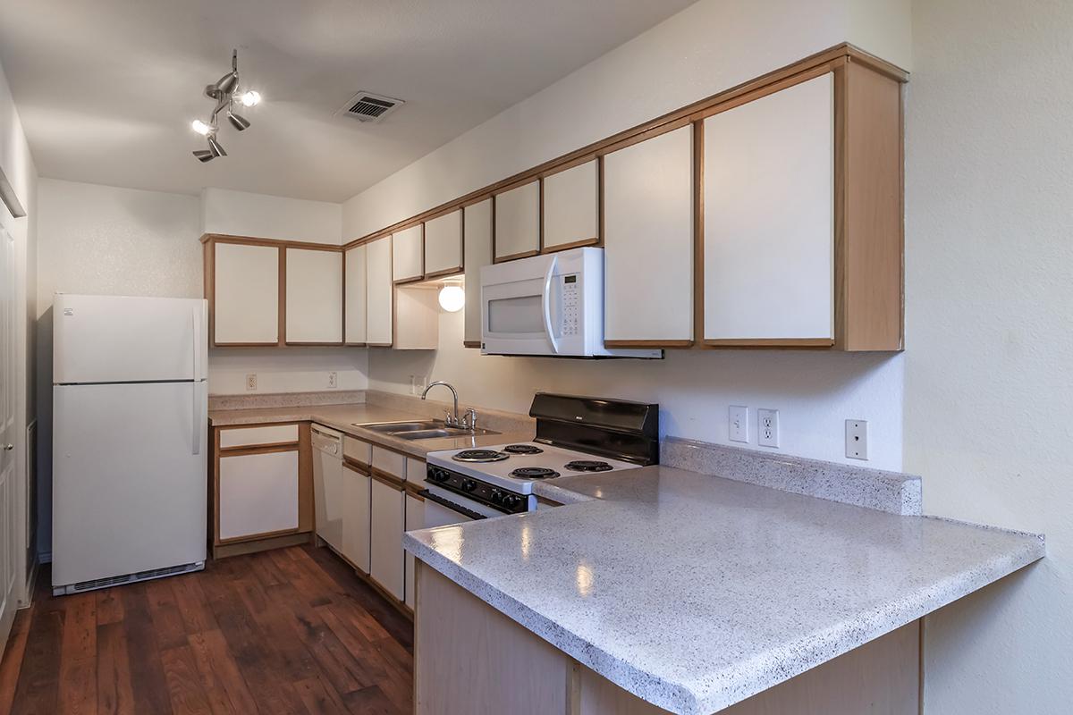 a kitchen with a stove and a sink