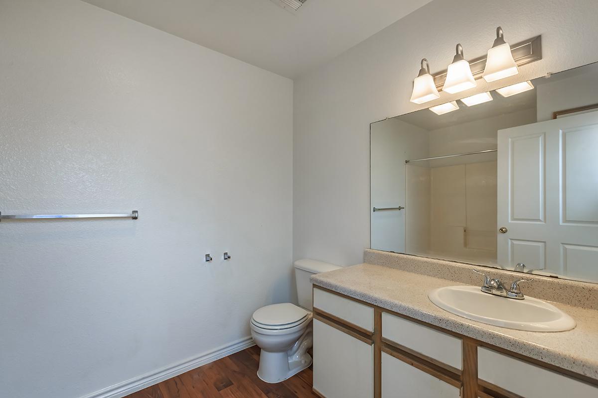 a room with a sink and a mirror