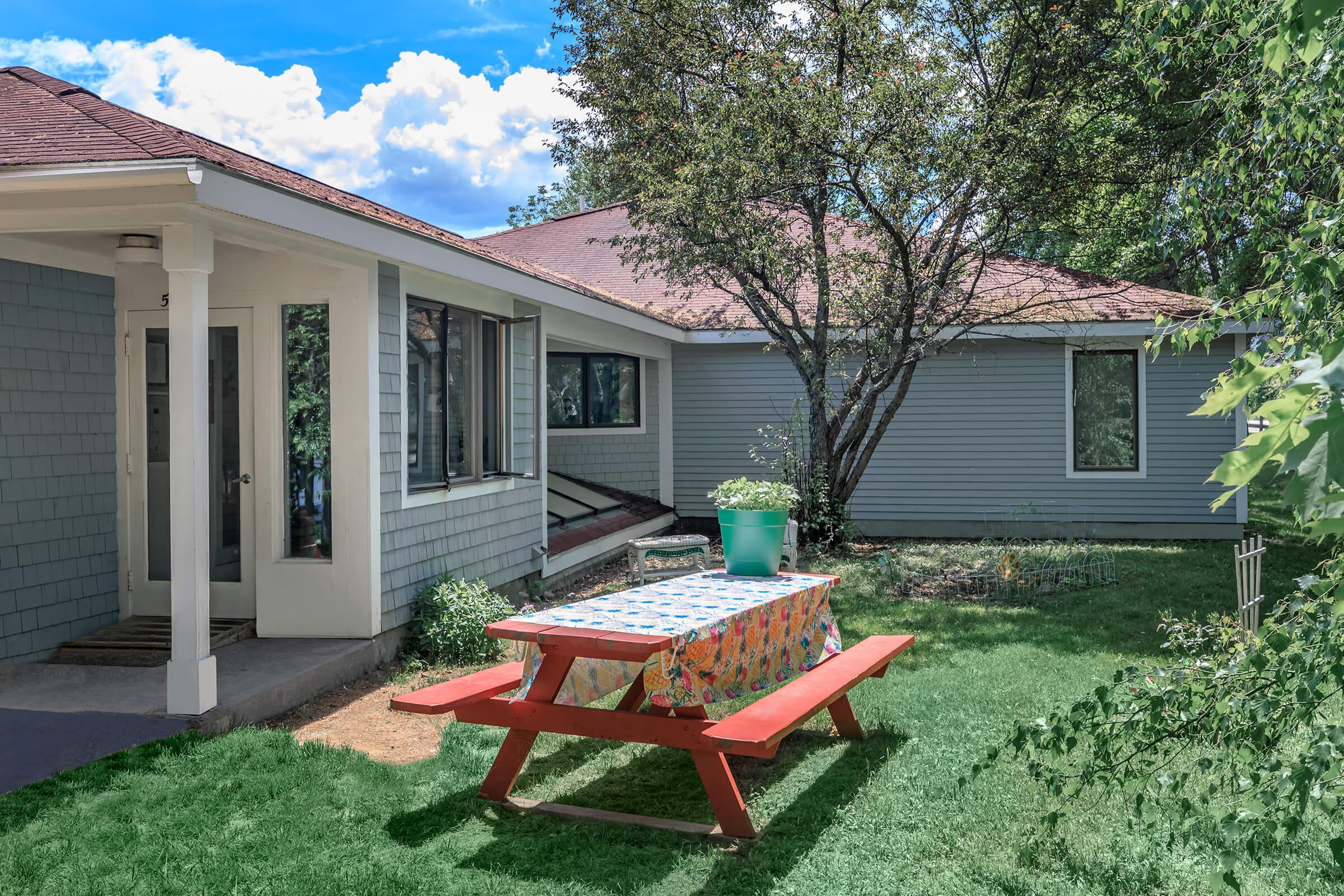 a lawn chair sitting in front of a house