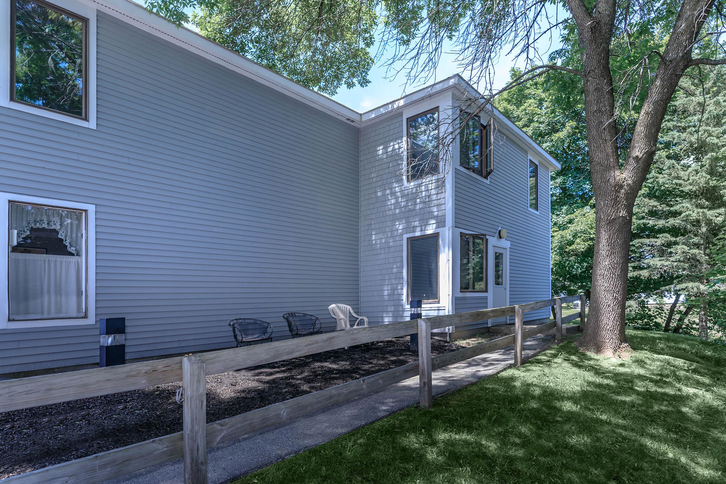 a house with trees in the background