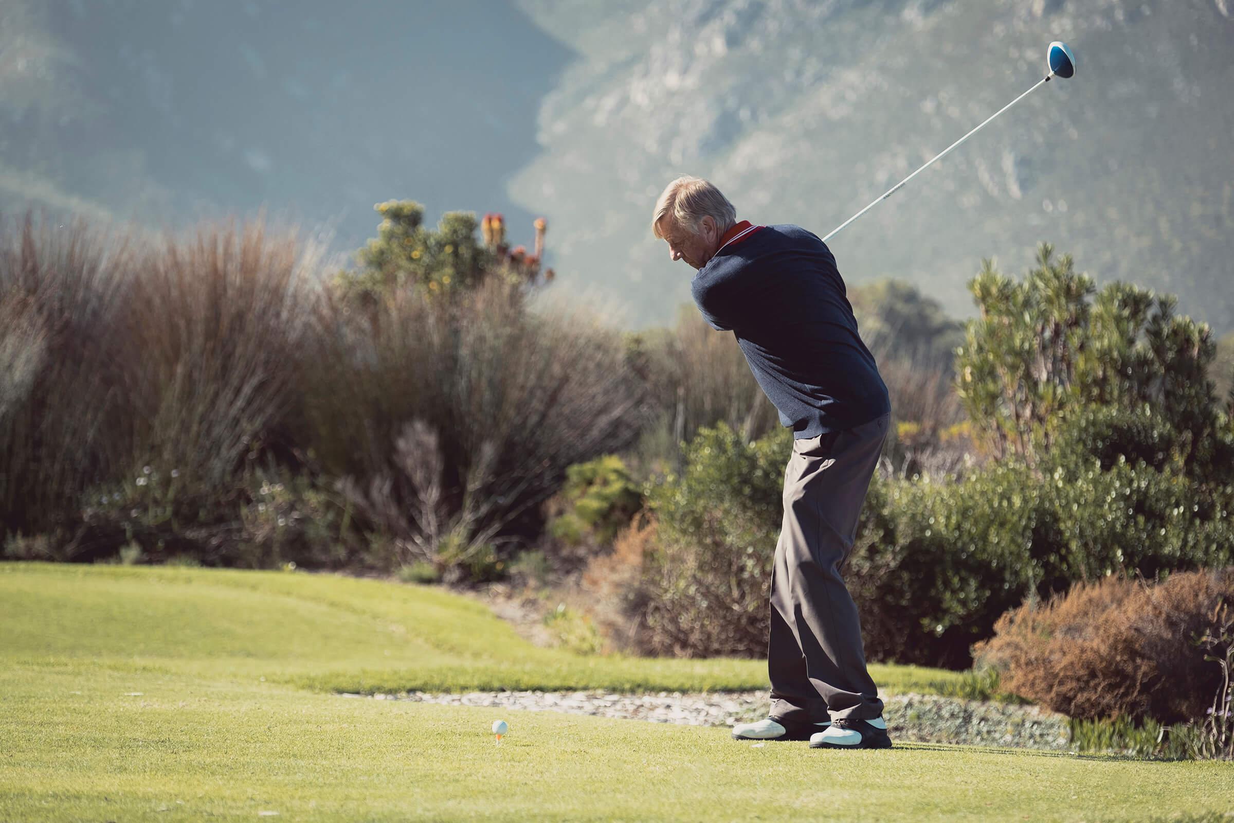 man playing golf near our active adult living apartment community
