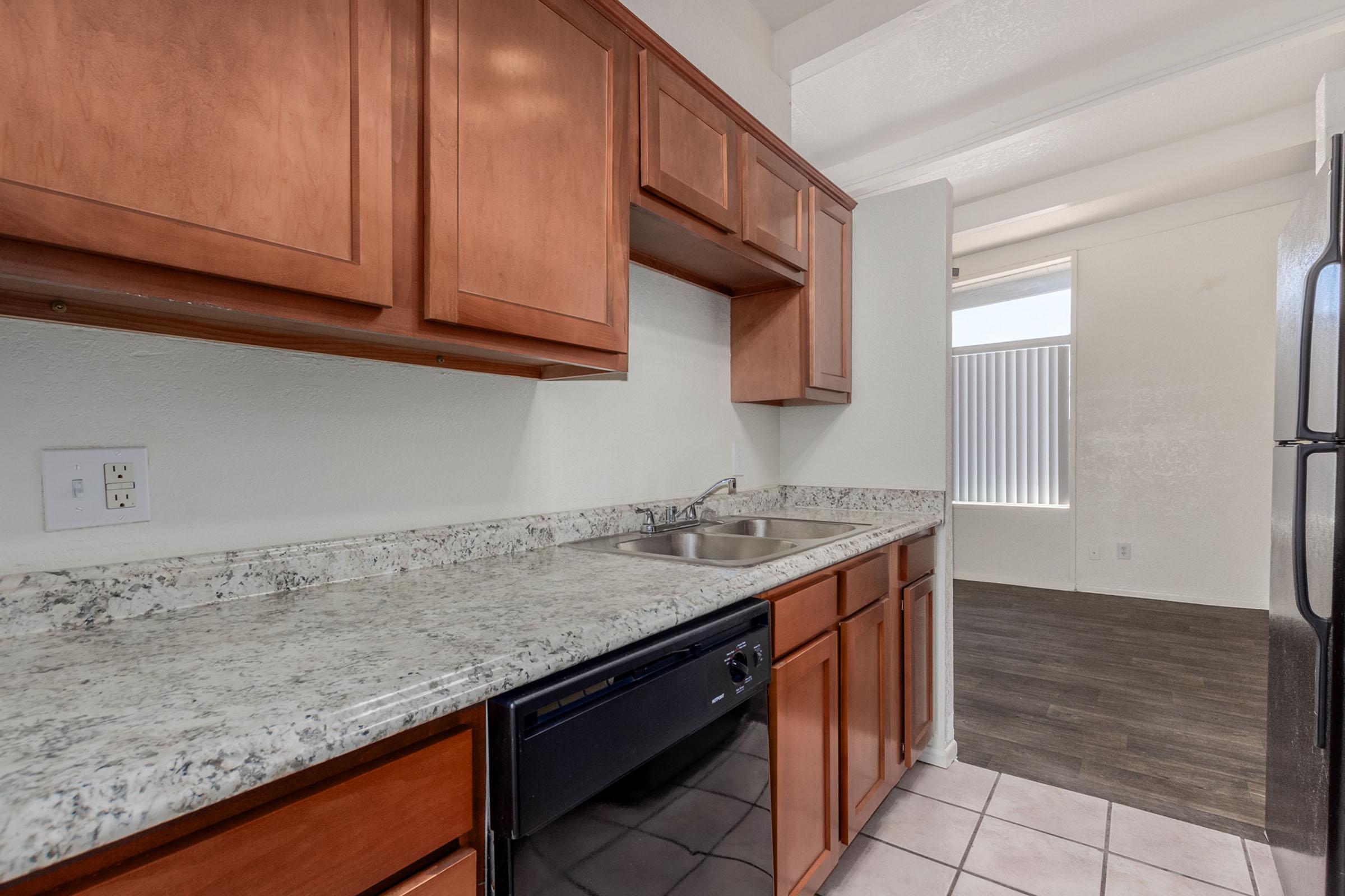 a kitchen with a tile floor