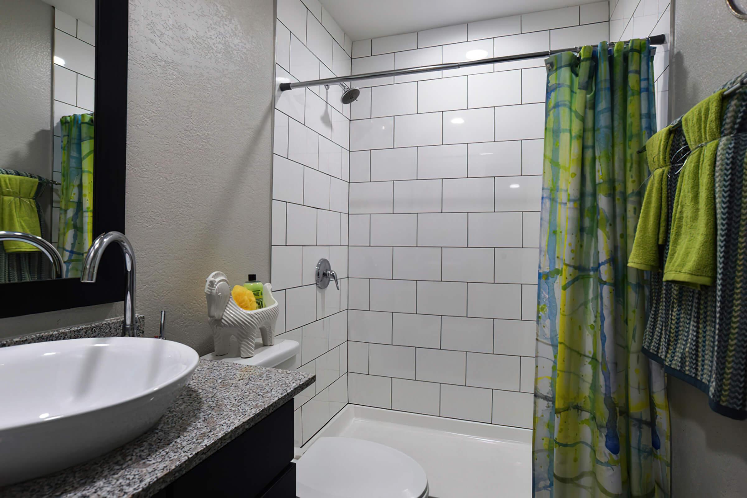 a sink and a shower curtain