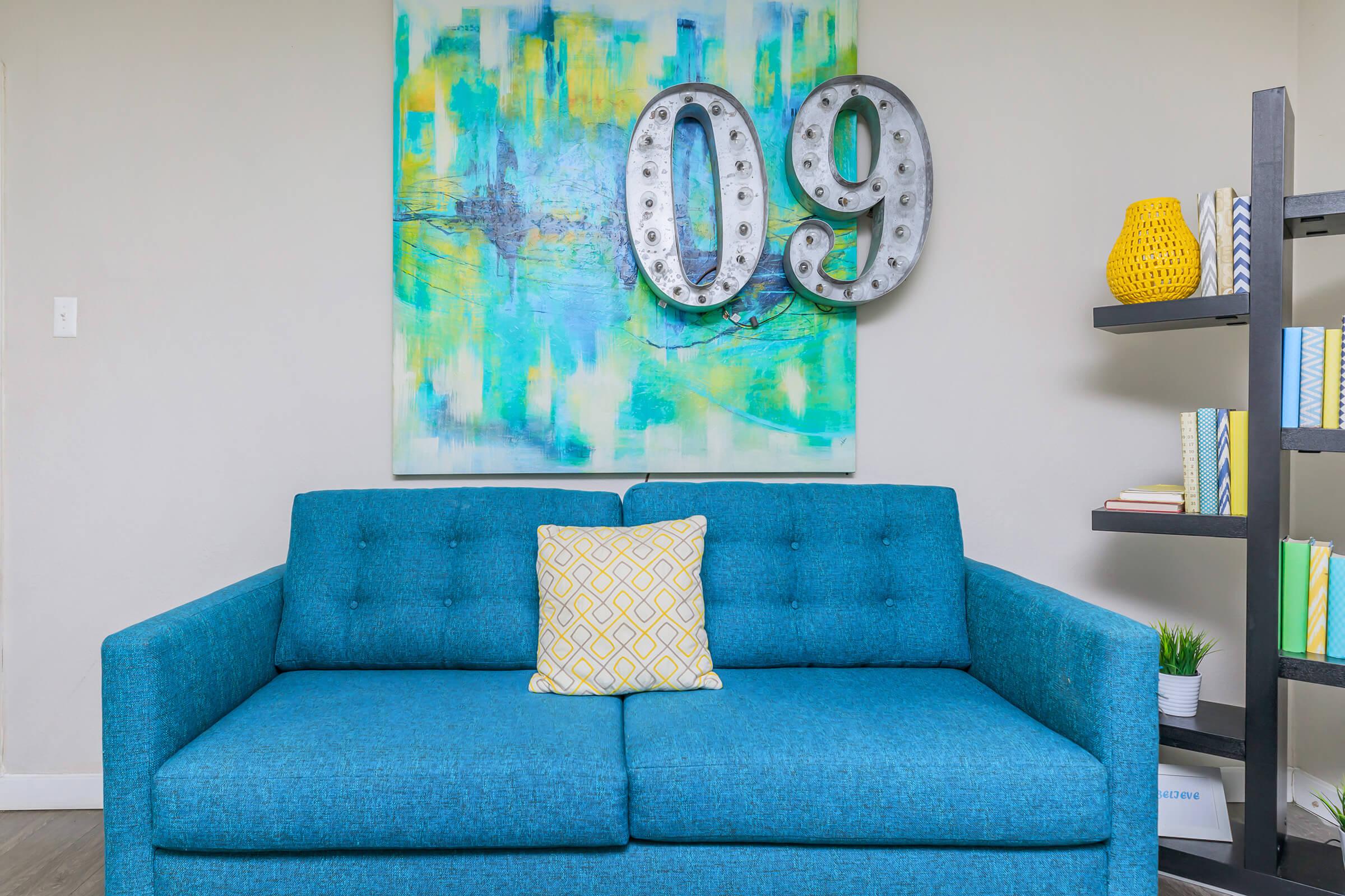 a blue chair in a room