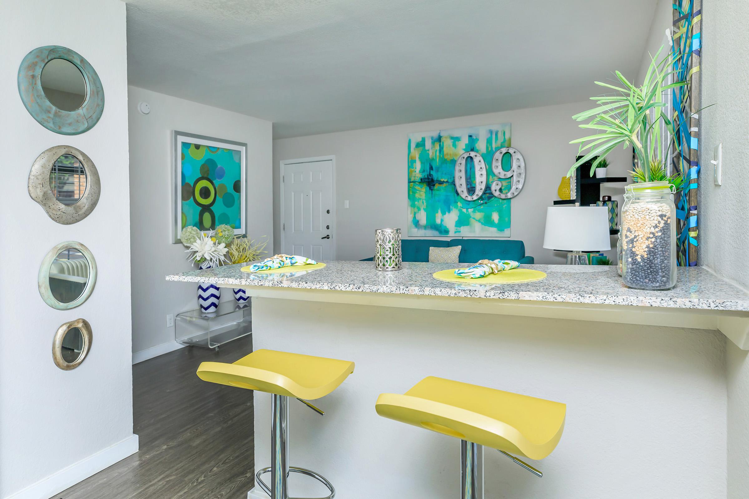 a kitchen with a table in a room