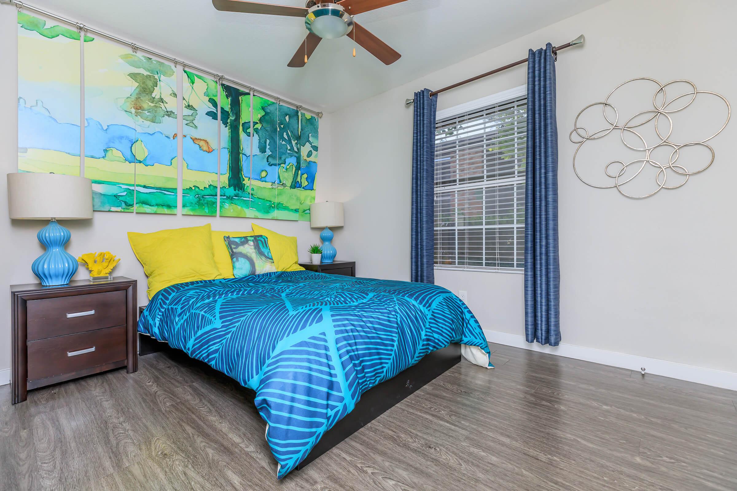 a bedroom with a blue blanket