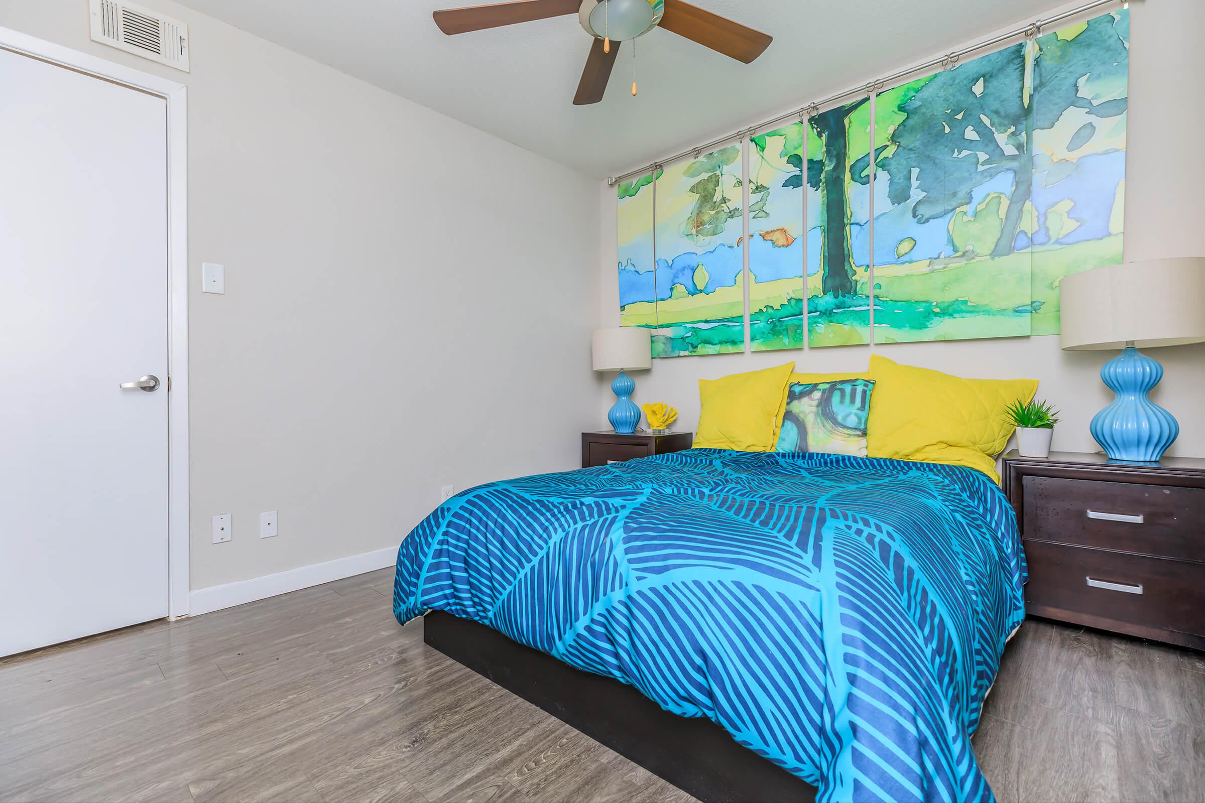 a bedroom with a blue background