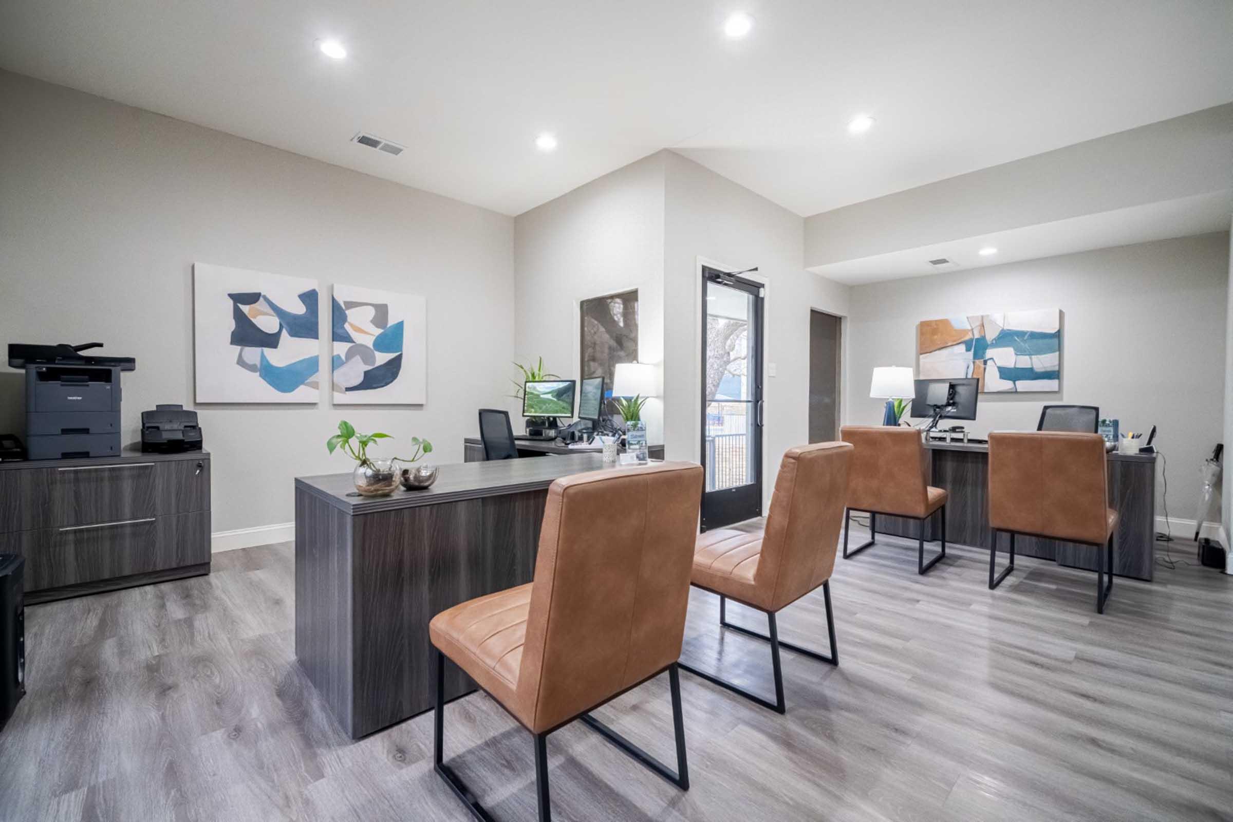 a living room filled with furniture and a wood floor