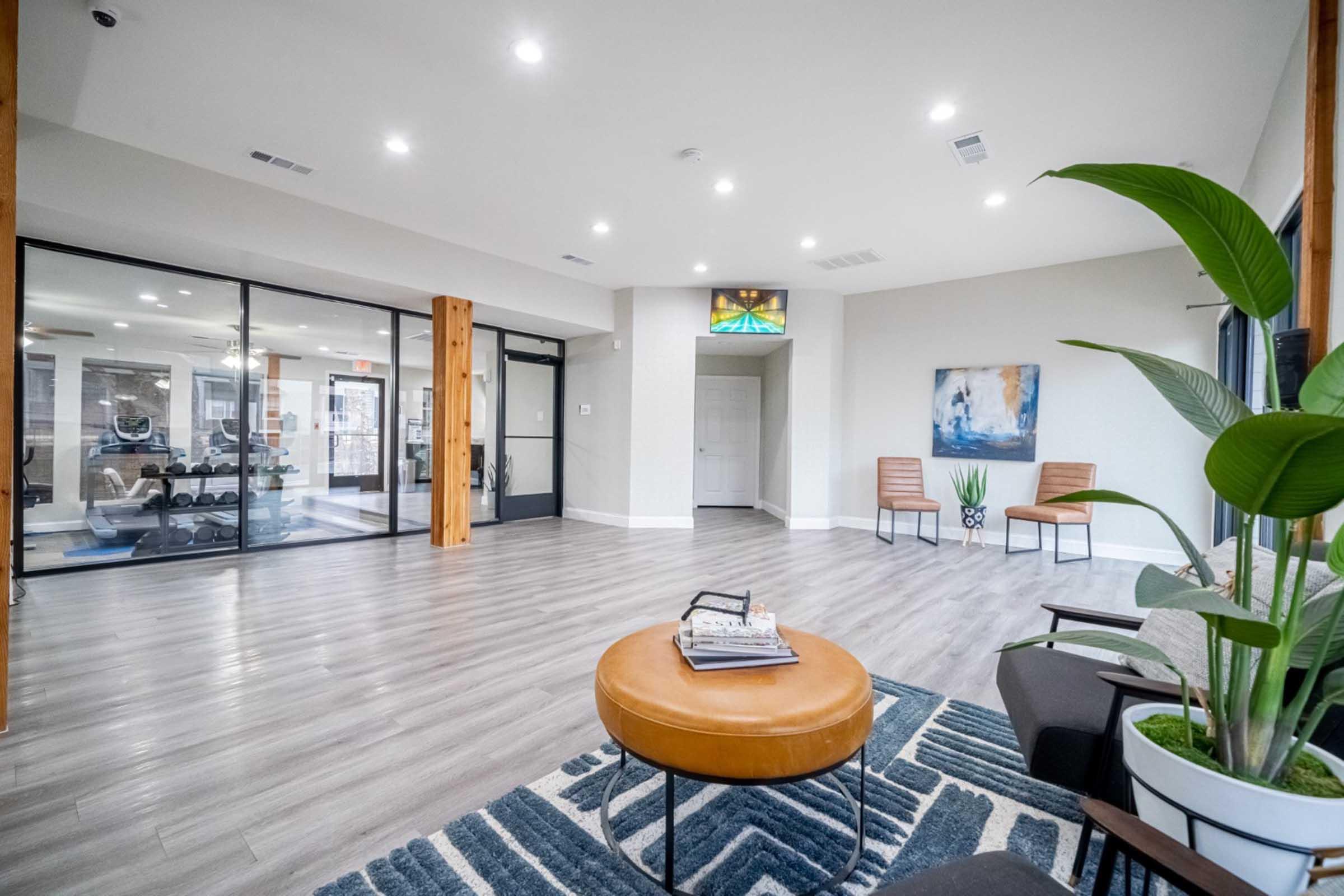 a room filled with furniture and vase on a table