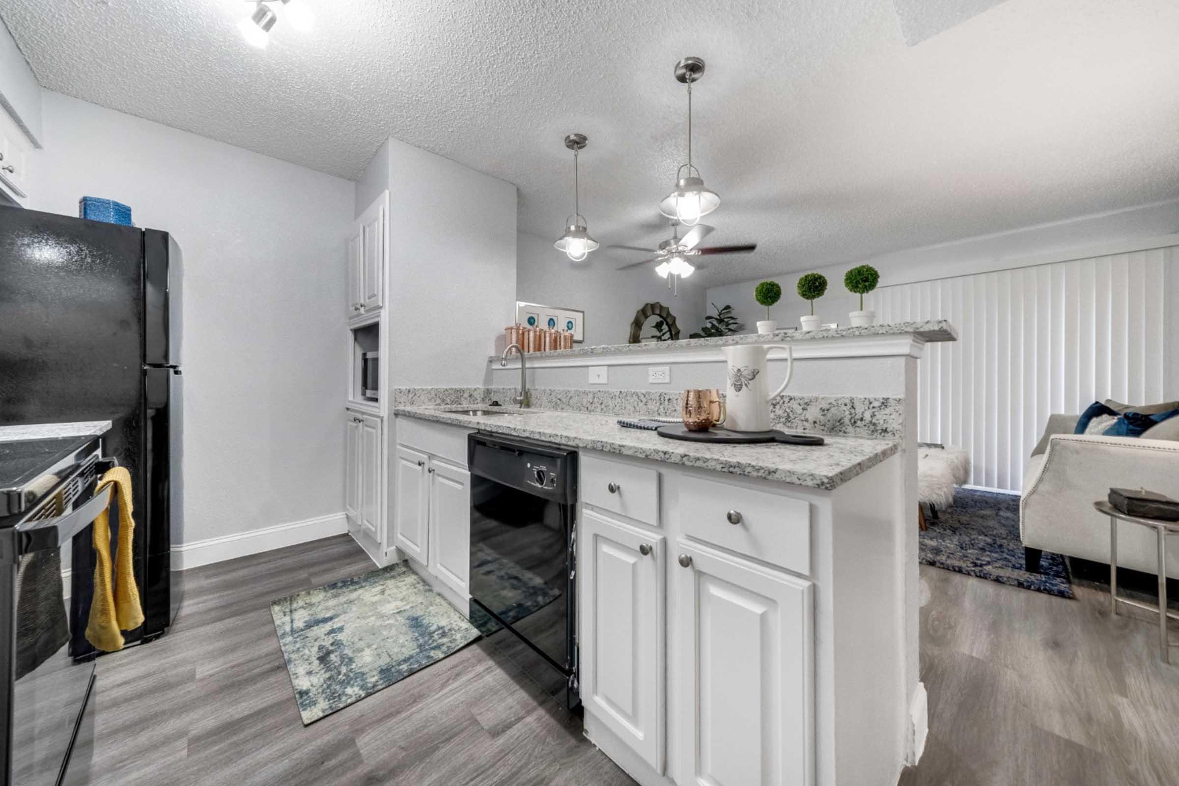 a large kitchen with stainless steel appliances