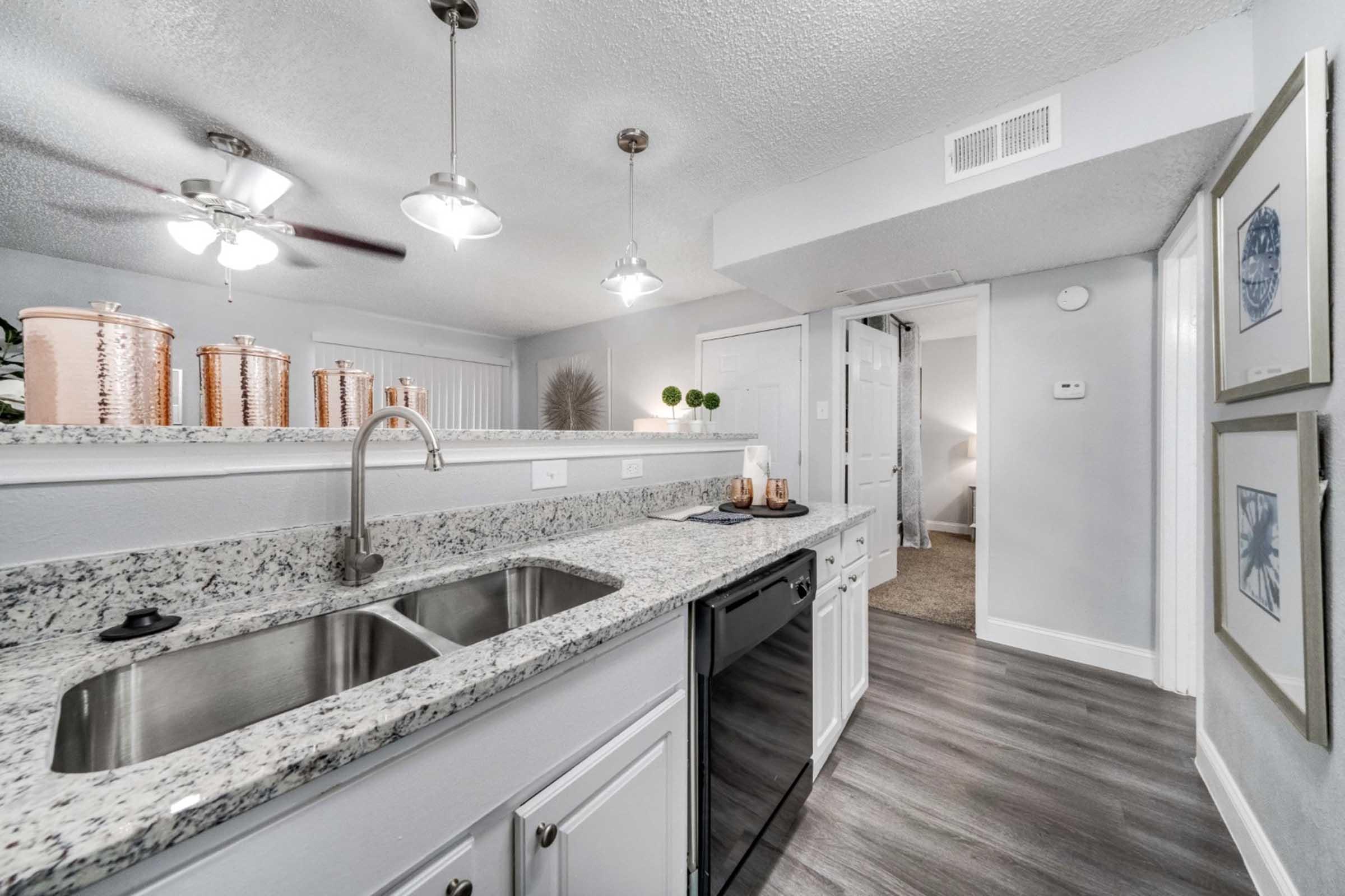 a kitchen with a stove and a sink