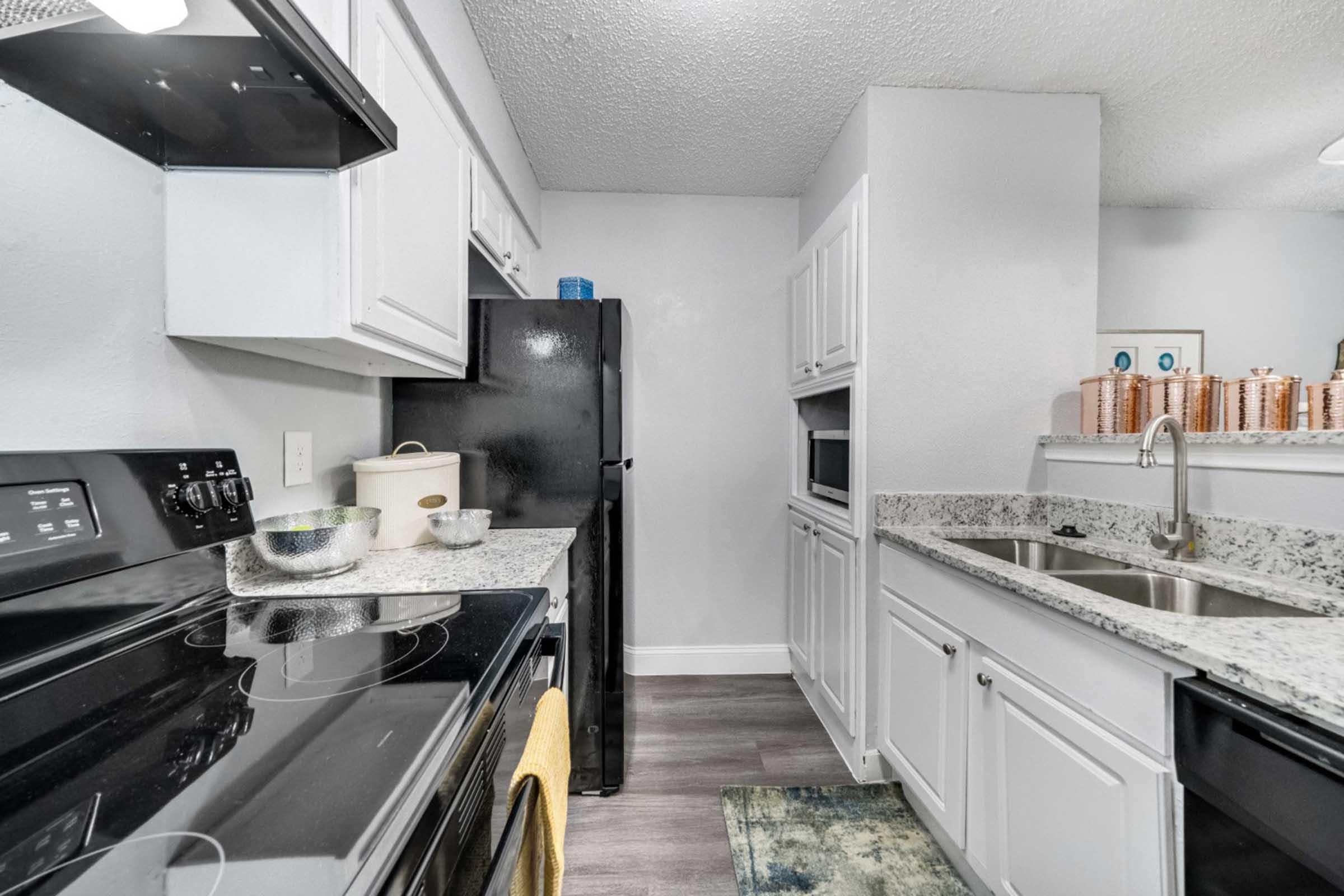 a kitchen with a stove and a sink