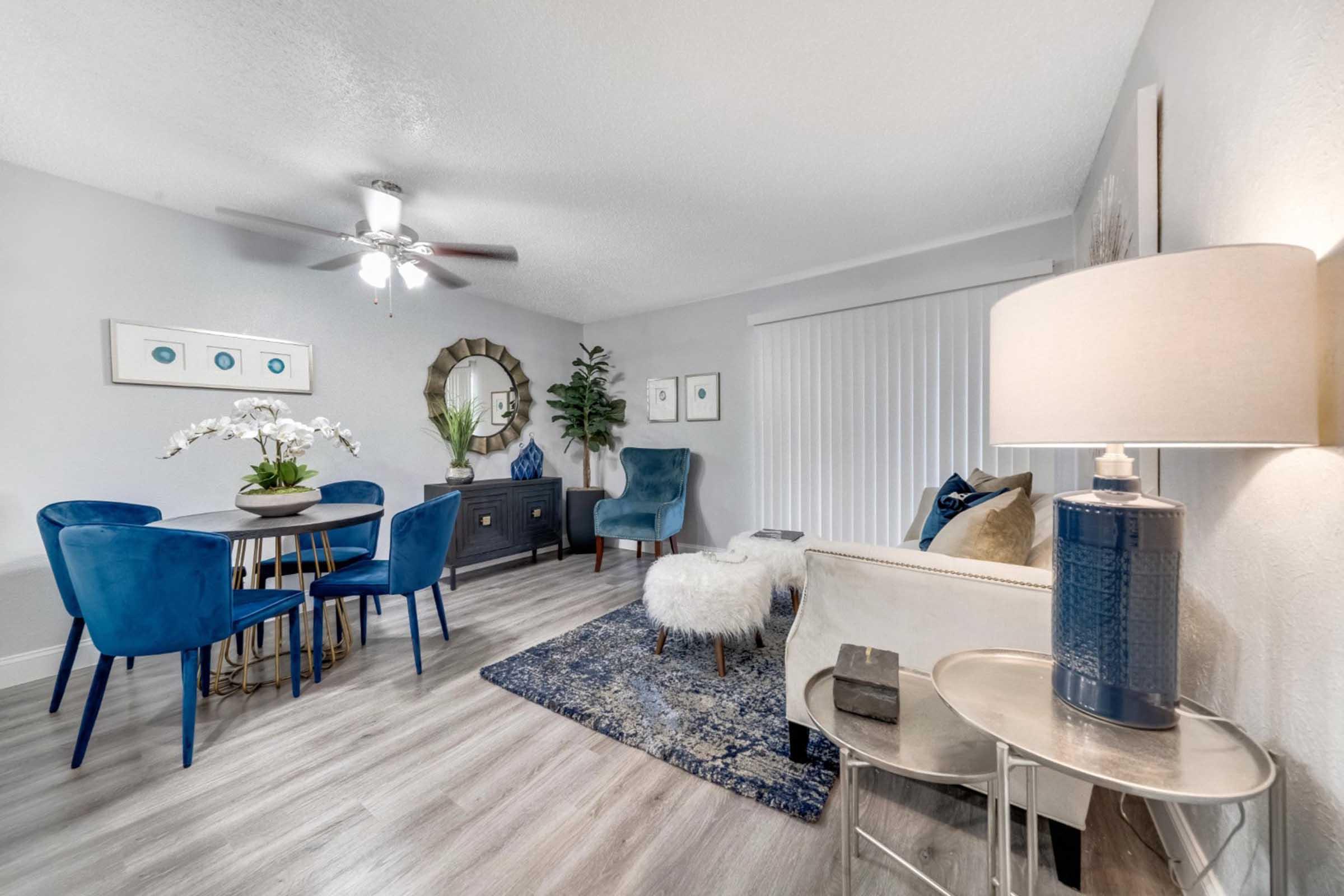 a living room filled with furniture and a table