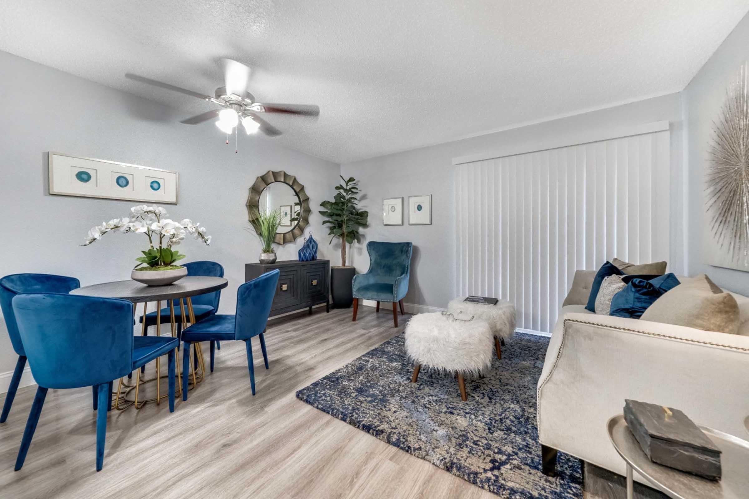 a living room filled with furniture and a table