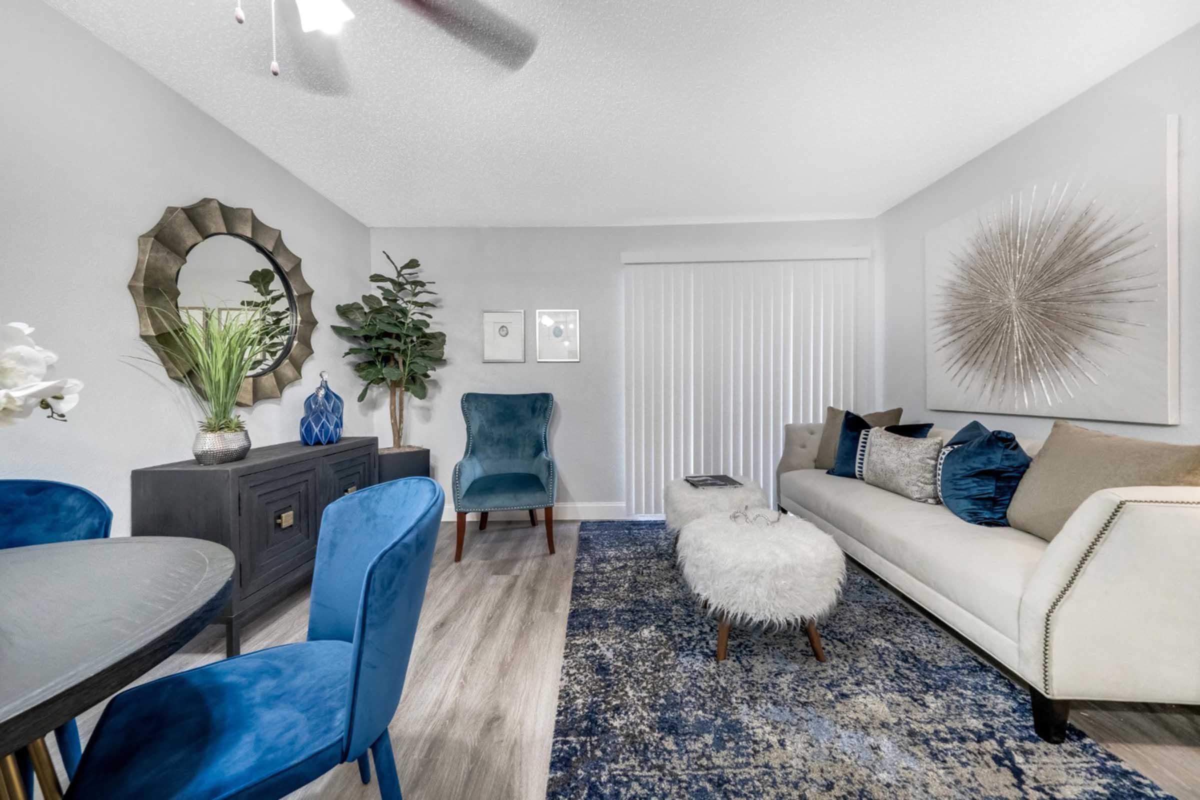 a living room with blue furniture