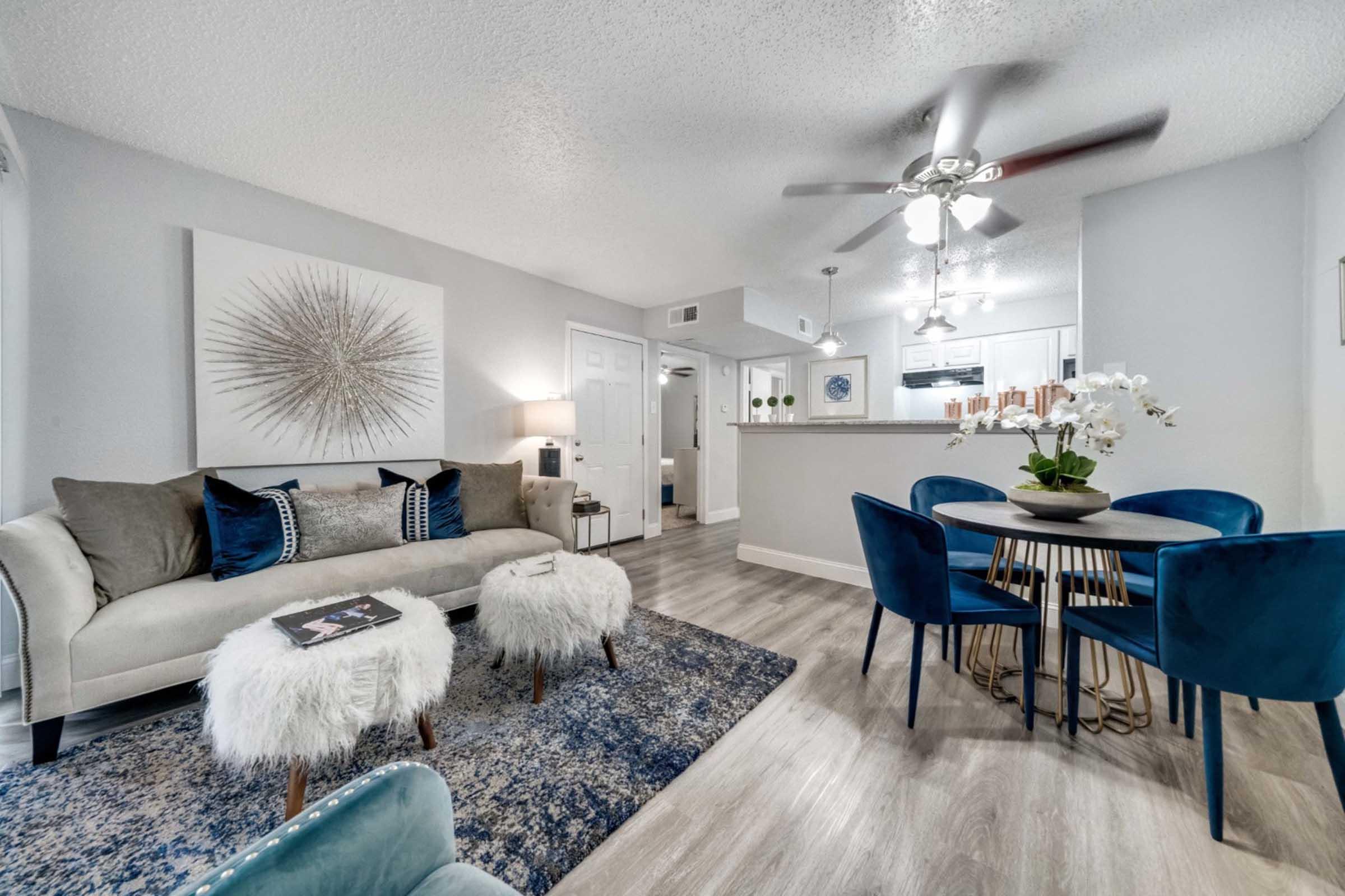 a living room filled with furniture and a table