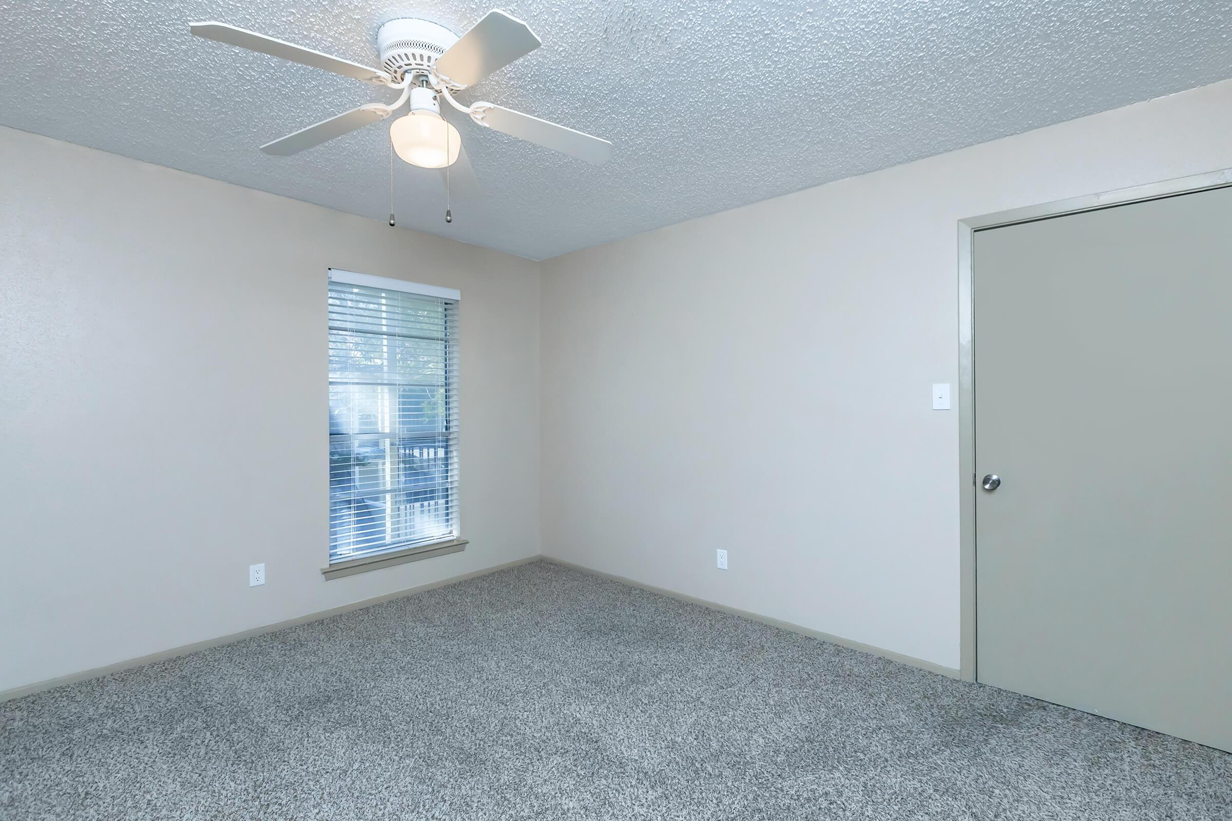 a bedroom with a large window