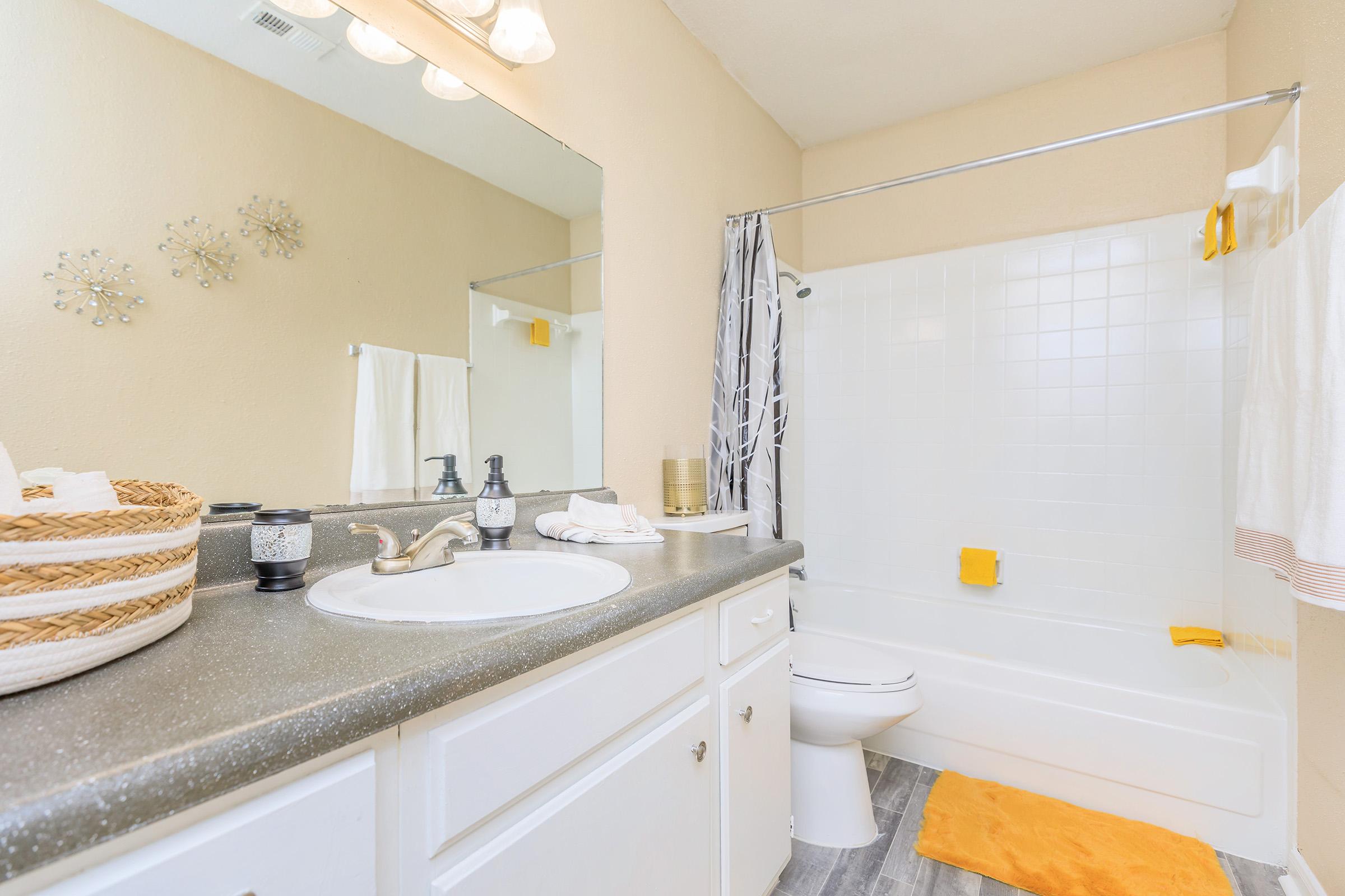 a kitchen with a sink and a mirror