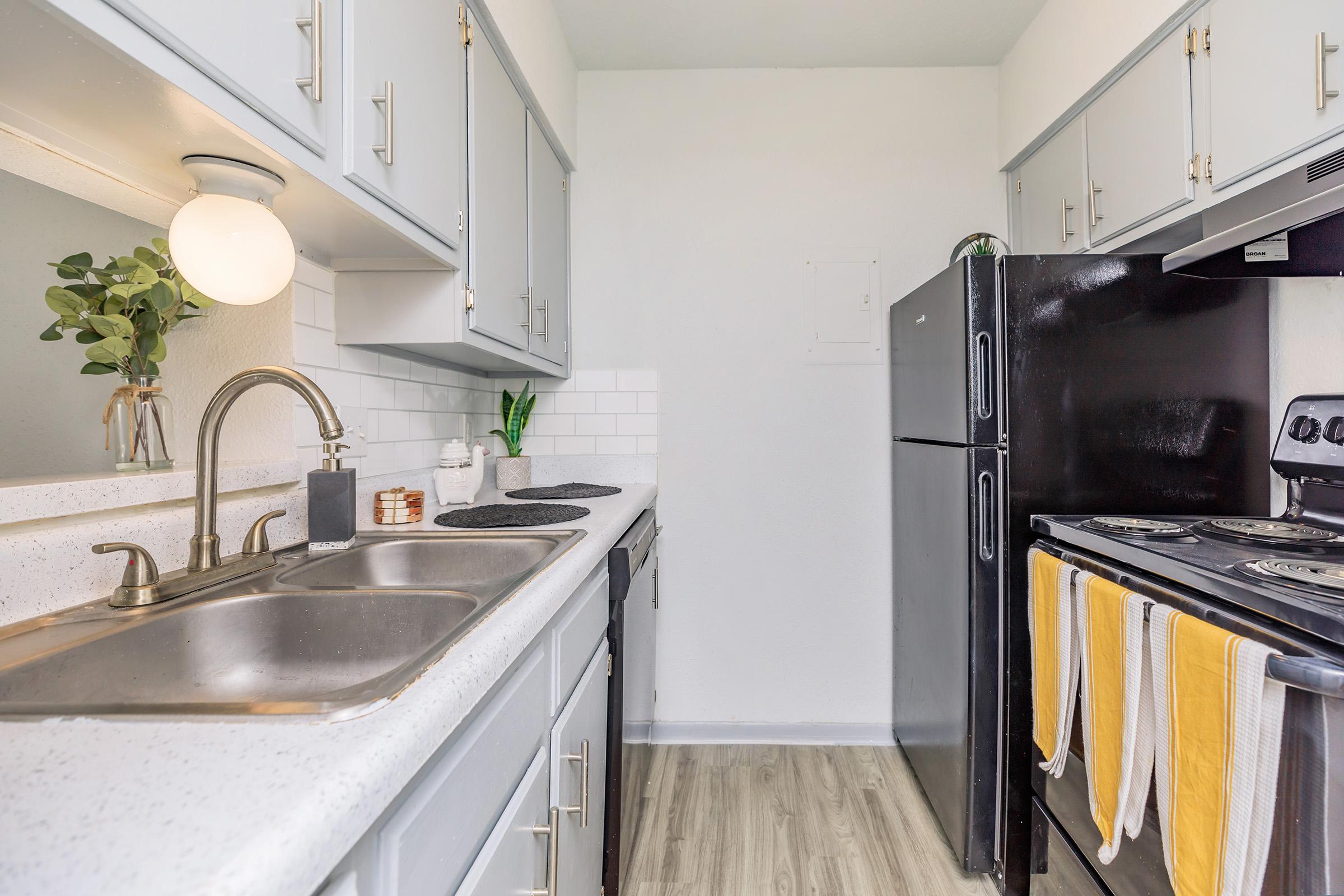 a kitchen with a stove and a sink